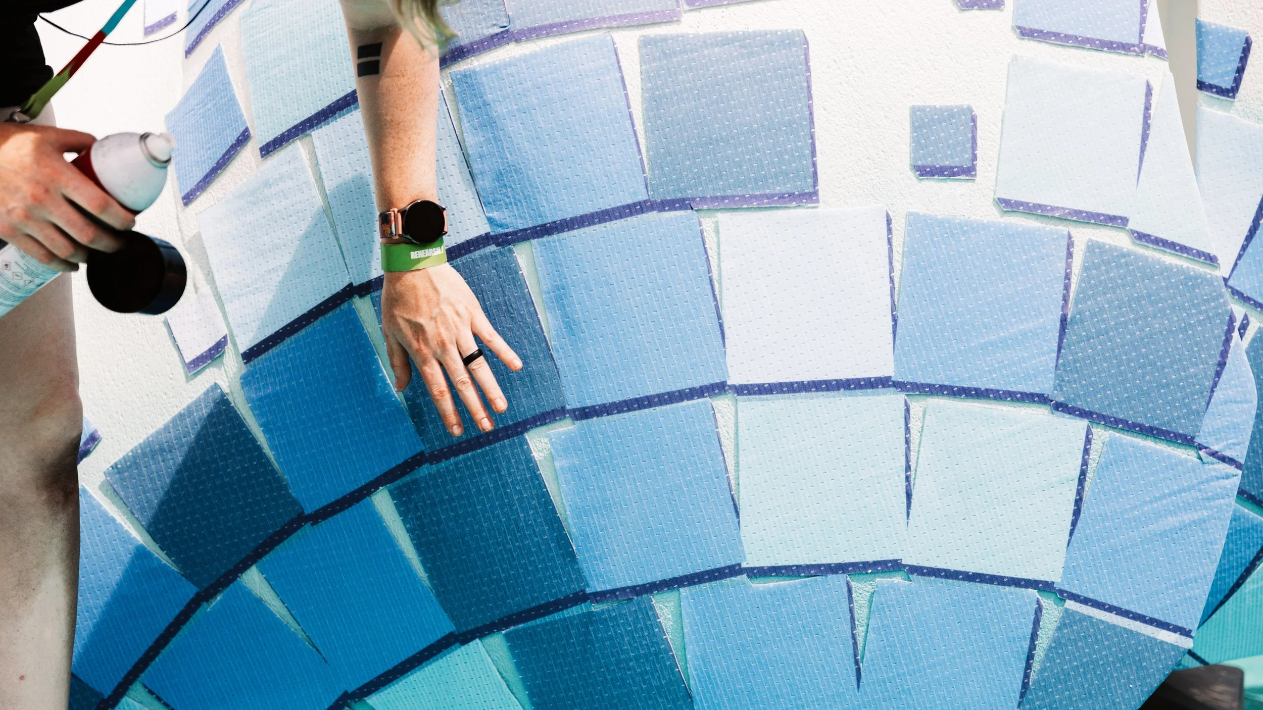 Close-up of the mosaic-inspired scenic finish, with individually applied translucent blue tiles creating a gradient pattern across the polar bear puppet.