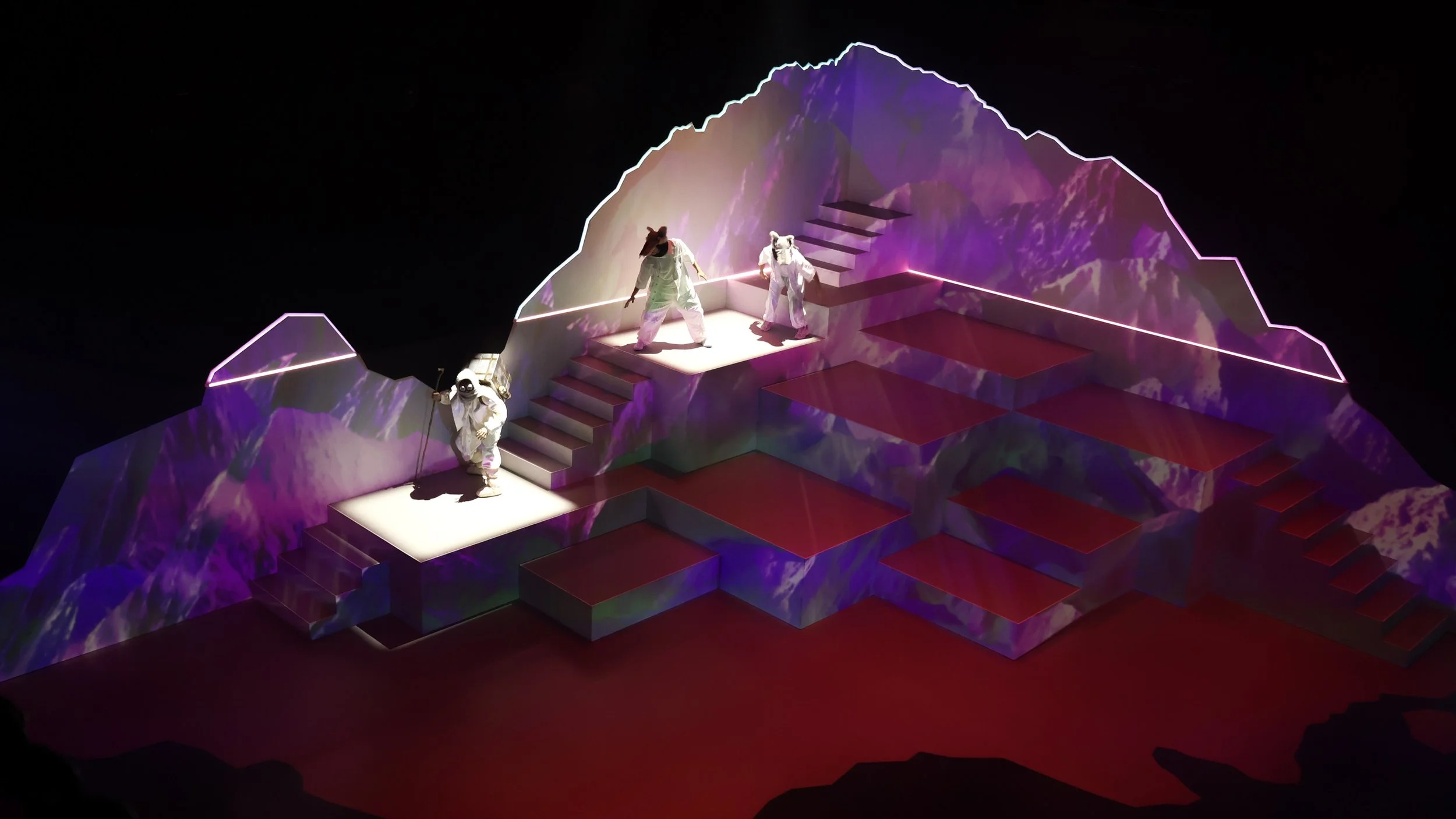 Snow landscape set with vivid projection colours and performers, innovative design by Ruby Law RULA