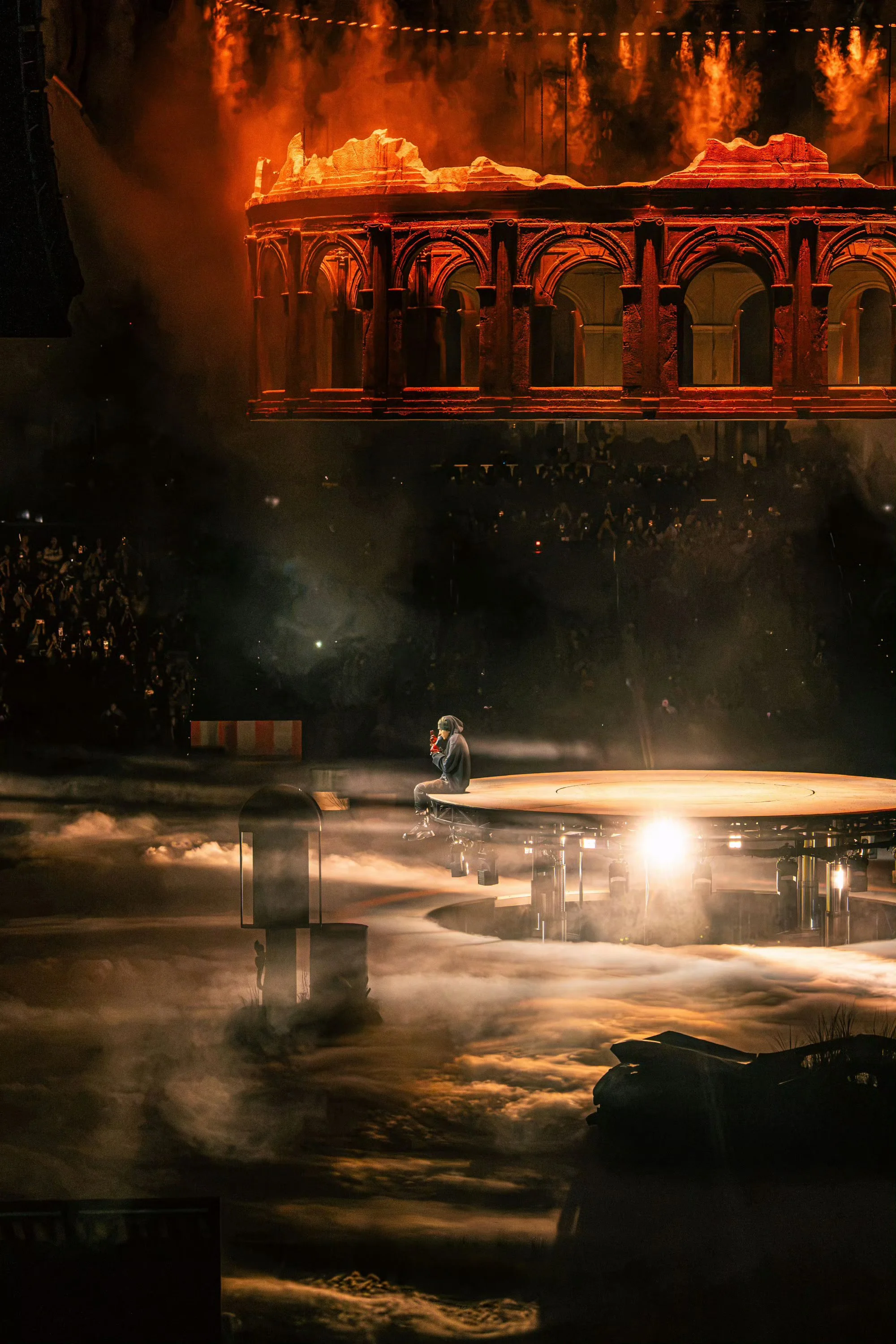 KUN 蔡徐坤 beneath the suspended colosseum in the surreal DEADMAN landscape, set and stage design by Ruby Law, RULA