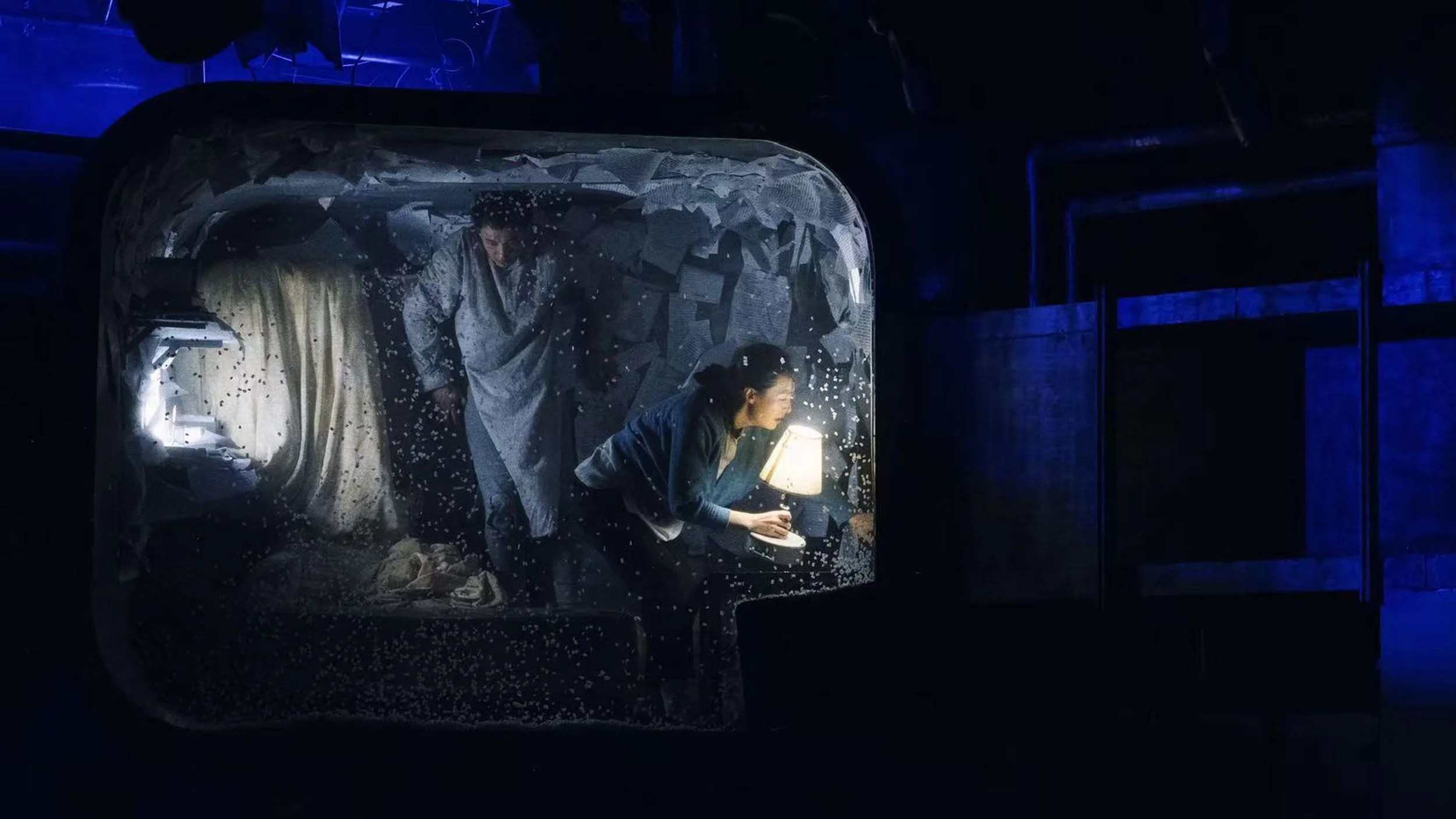Perspective shot of the nest where the protagonist created in 'Metamorphosis'. Set design by Ruby Law (RULA), where the room is turned upside down, covered with paper and script.