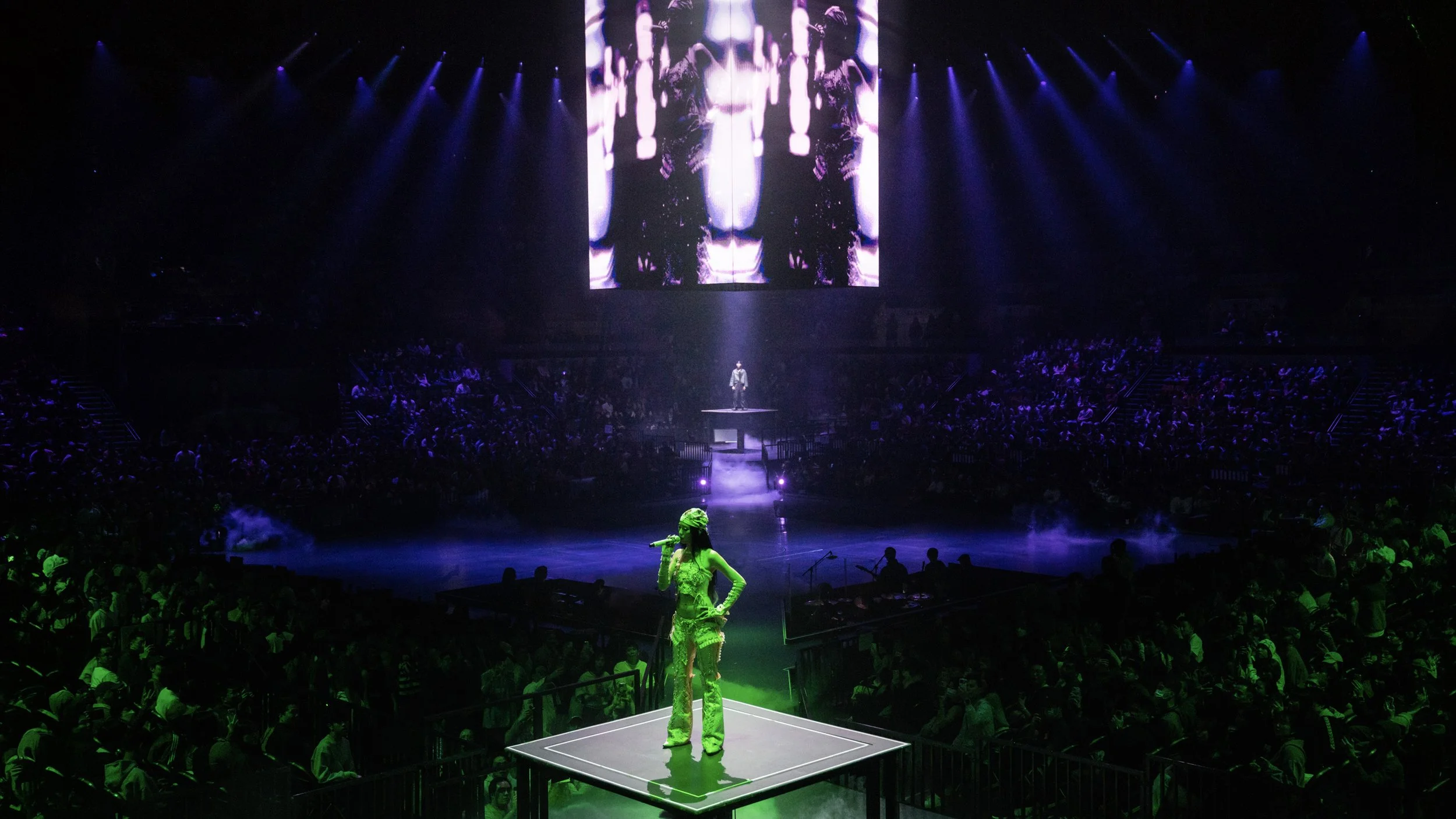Large scale LED screens and dynamic lighting creating portal like transitions in Jace World concert, pop concert stage design by London set designer Ruby Law.