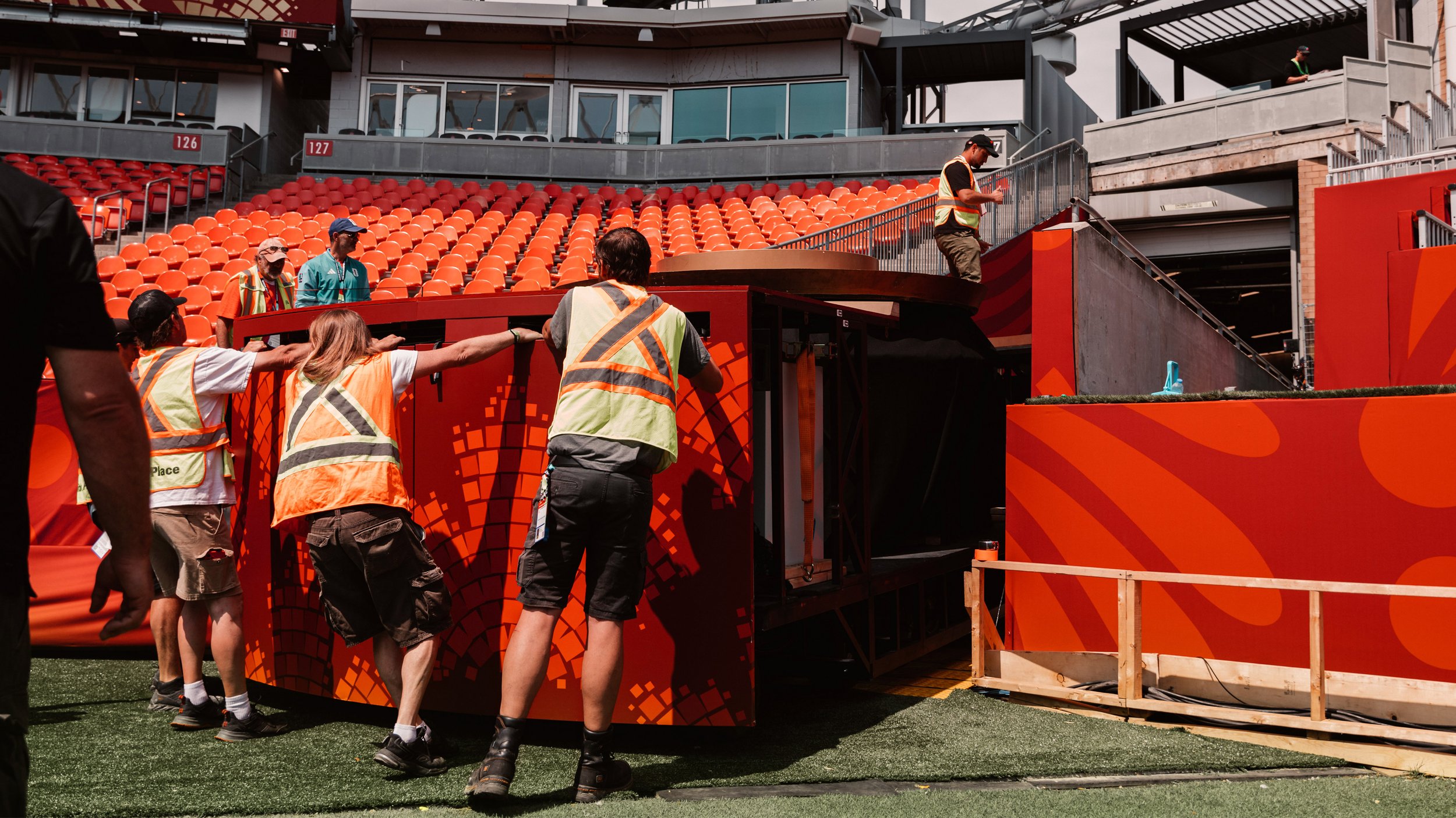 Crew rehearsing deployment of the stadium-scale field cloth before the FIFA World Cup 2026 Toronto Opening Ceremony.
