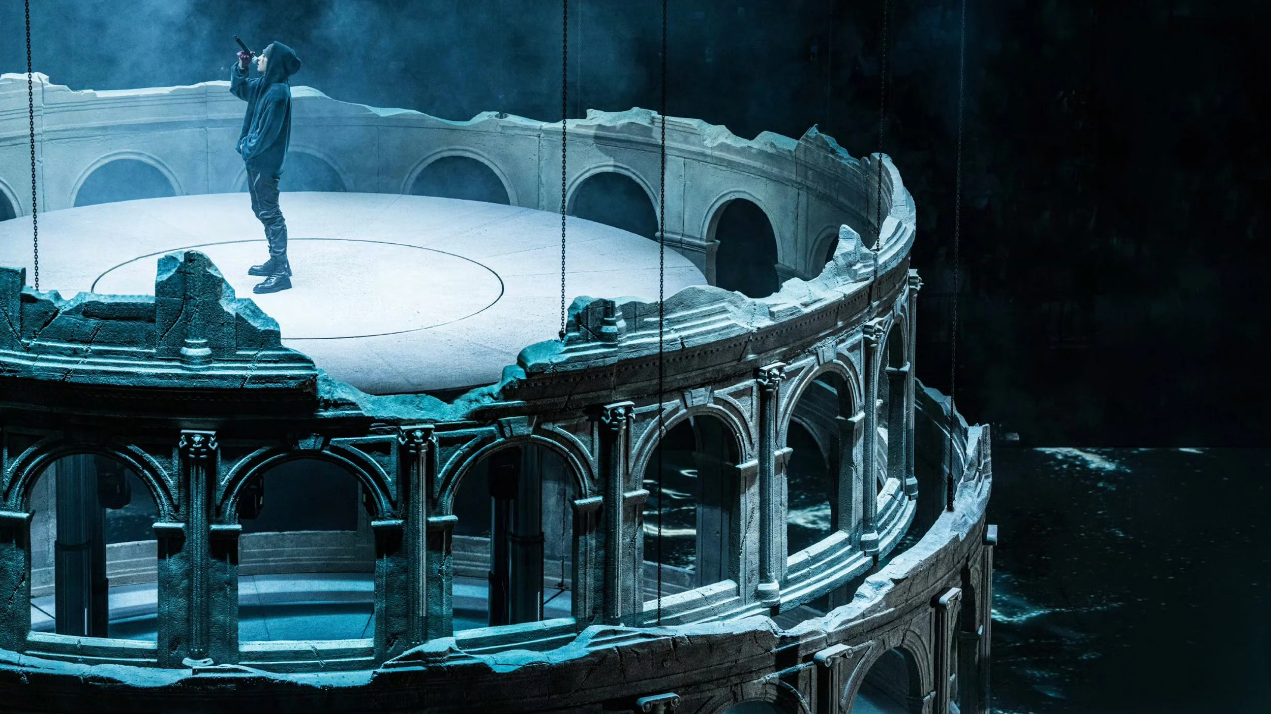 KUN 蔡徐坤 performing on top of the suspended ruined colosseum in DEADMAN, set design by Ruby Law 舞美设计师