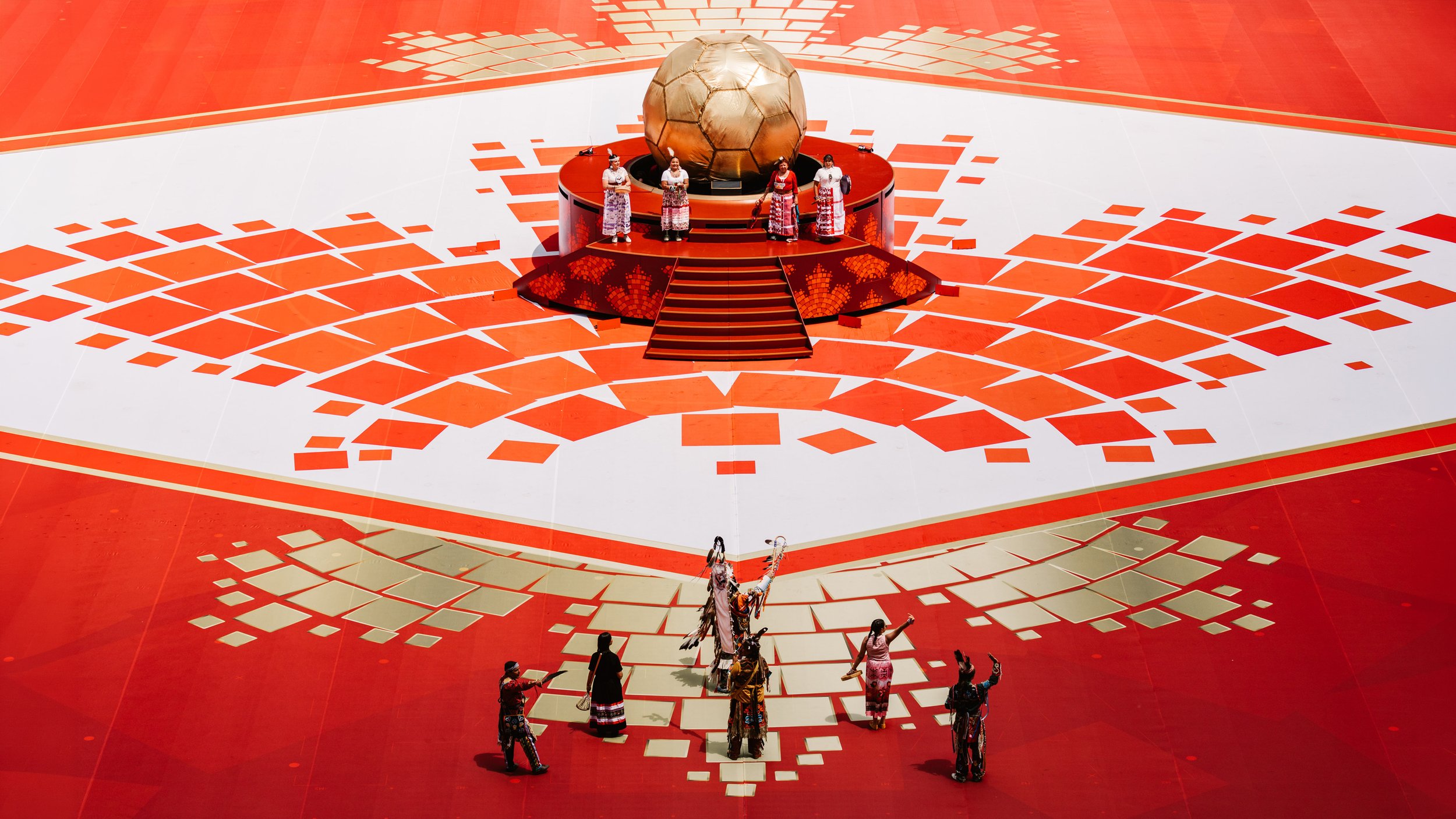 First Nations drummers performing around the golden sphere during the opening sequence of the FIFA World Cup 2026 Toronto Opening Ceremony.
