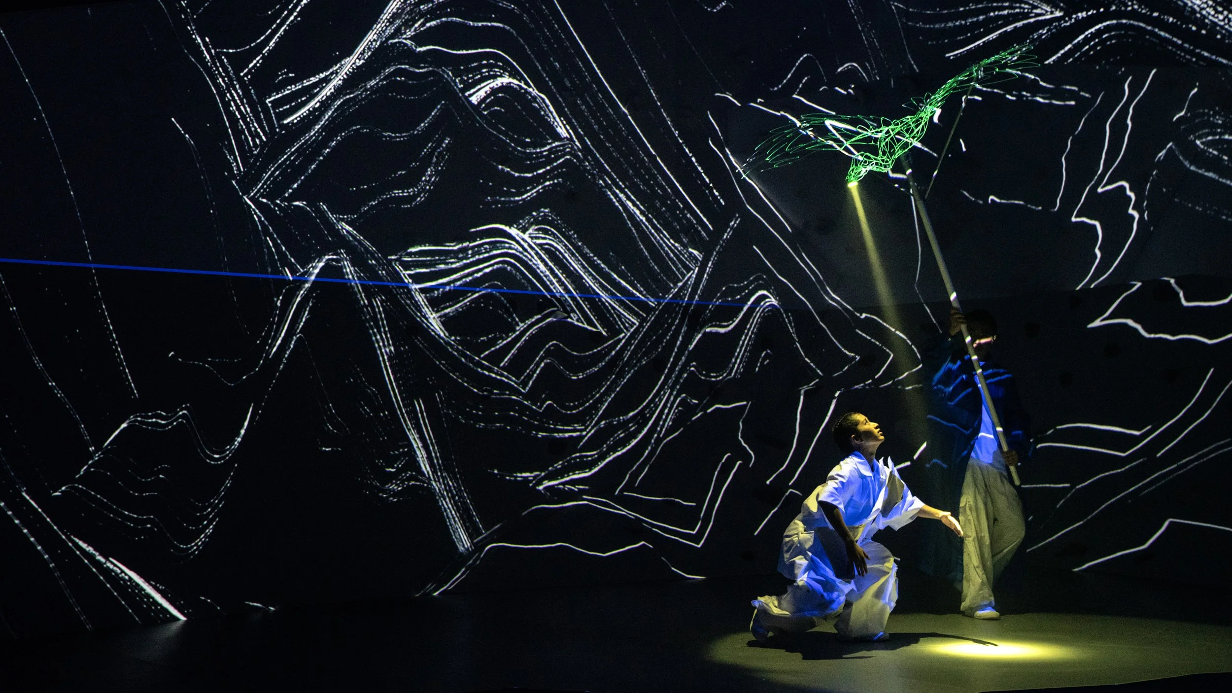 UV-lit vulture puppet flying above performer, immersive theatre design by Ruby Law RULA London set designer
