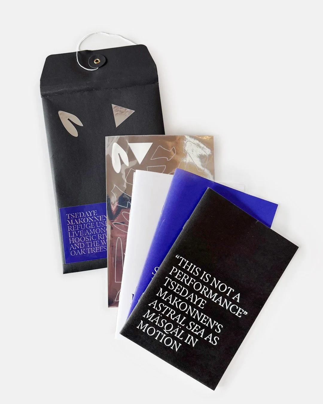 An envelope, three booklets and a sticker sheet