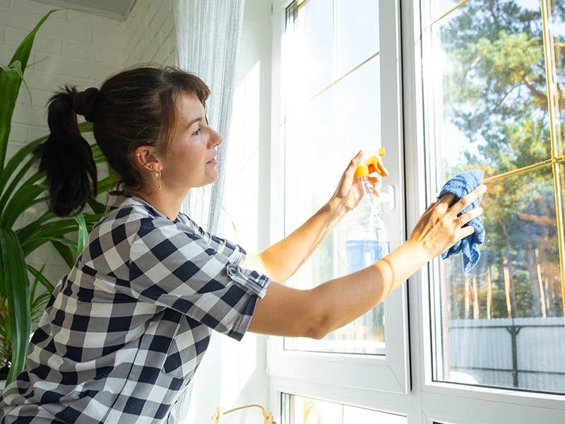 women in maine home spring cleaning