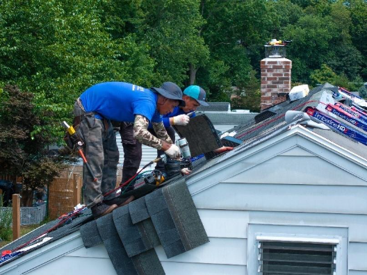 Earthlight Tech contractor working on a roofing replacement on a residential home.