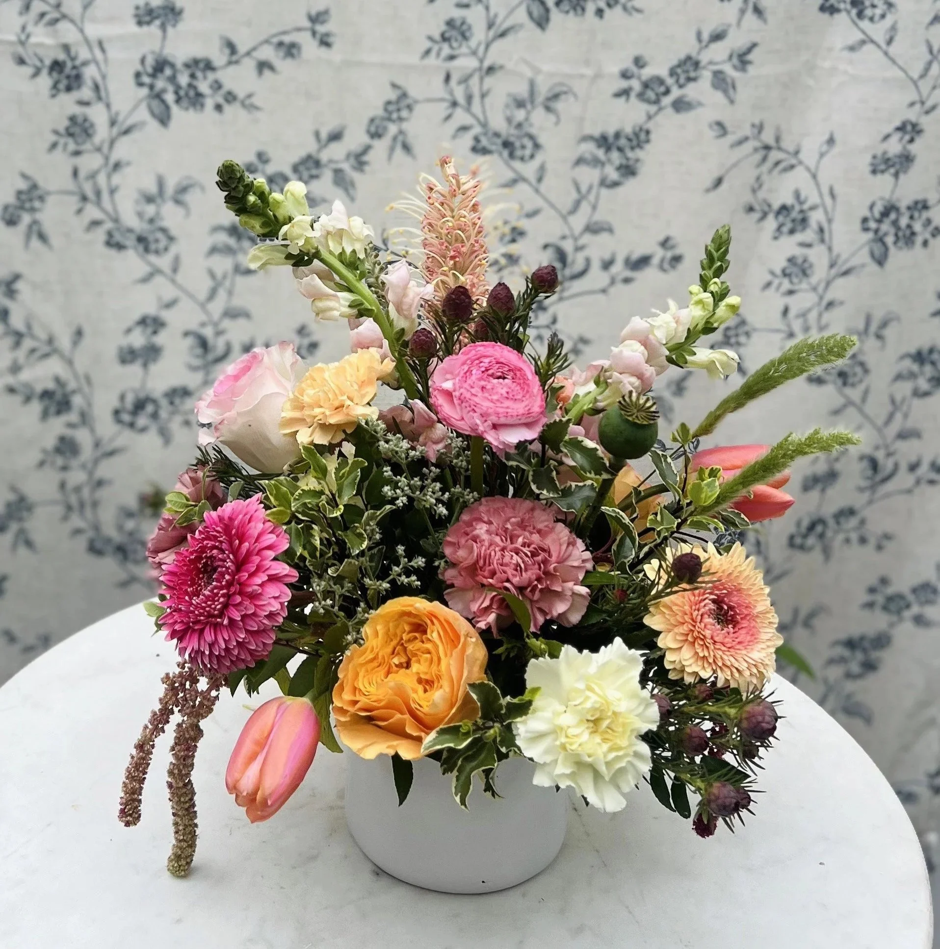 Spring garden floral arrangement with natural texture and loose organic design