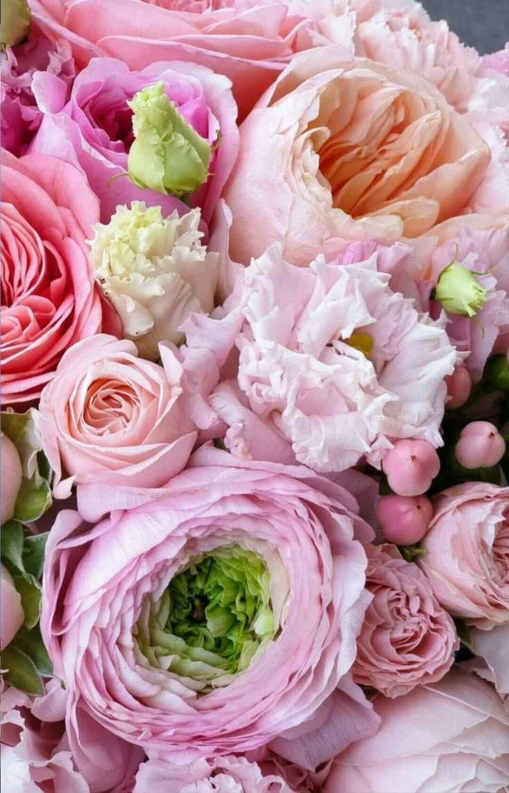 Close-up of pink floral arrangement with layered blooms and gentle movement