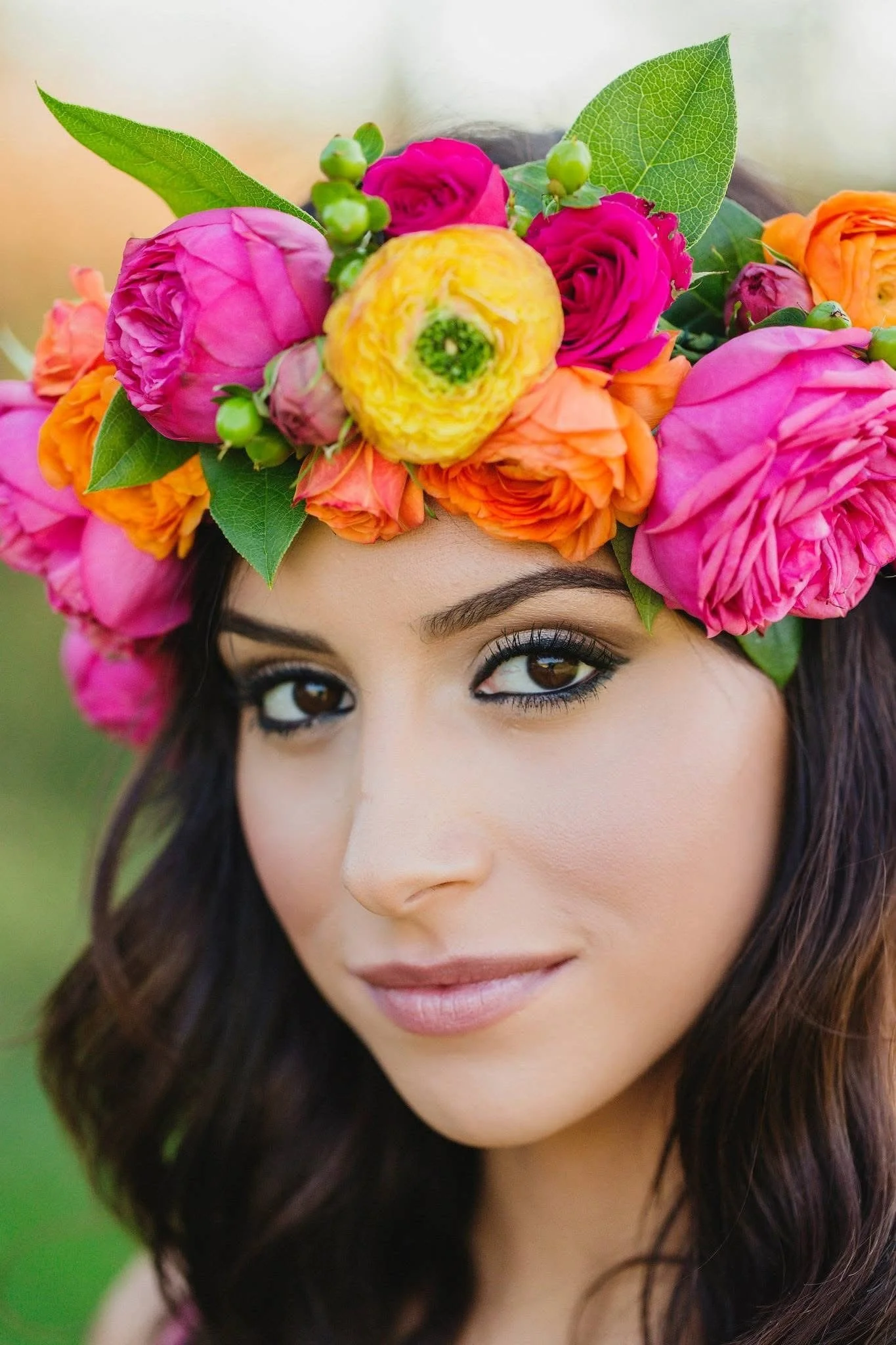 Custom floral graduation crown with fresh seasonal flowers and greenery
