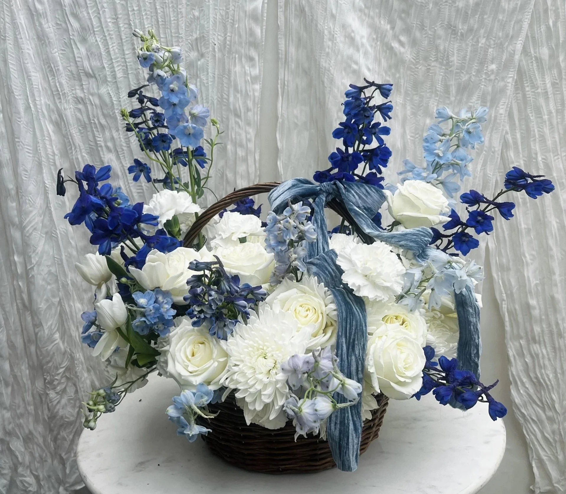 white-blue-flower-arrangement-wicker-basket-riverside-ca.jpg