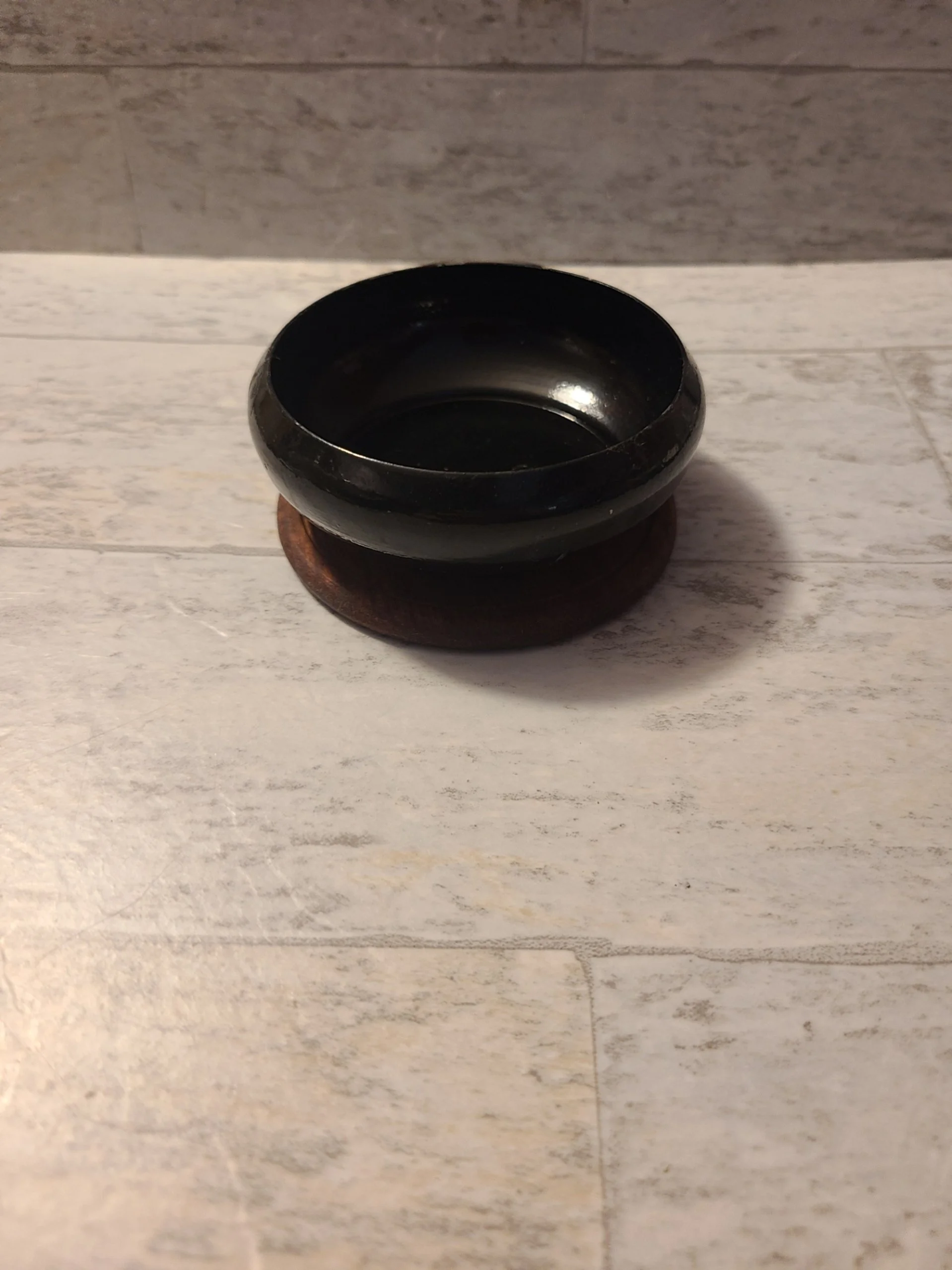 Metal charcoal burner with wooden coaster