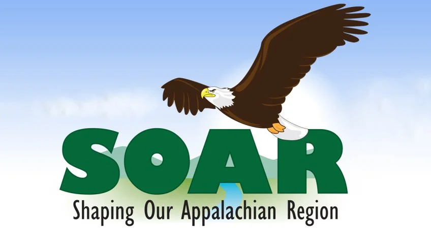Illustration of a bald eagle flying over the word 'SOAR' with the slogan 'Shaping Our Appalachian Region' beneath, set against a sky background.
