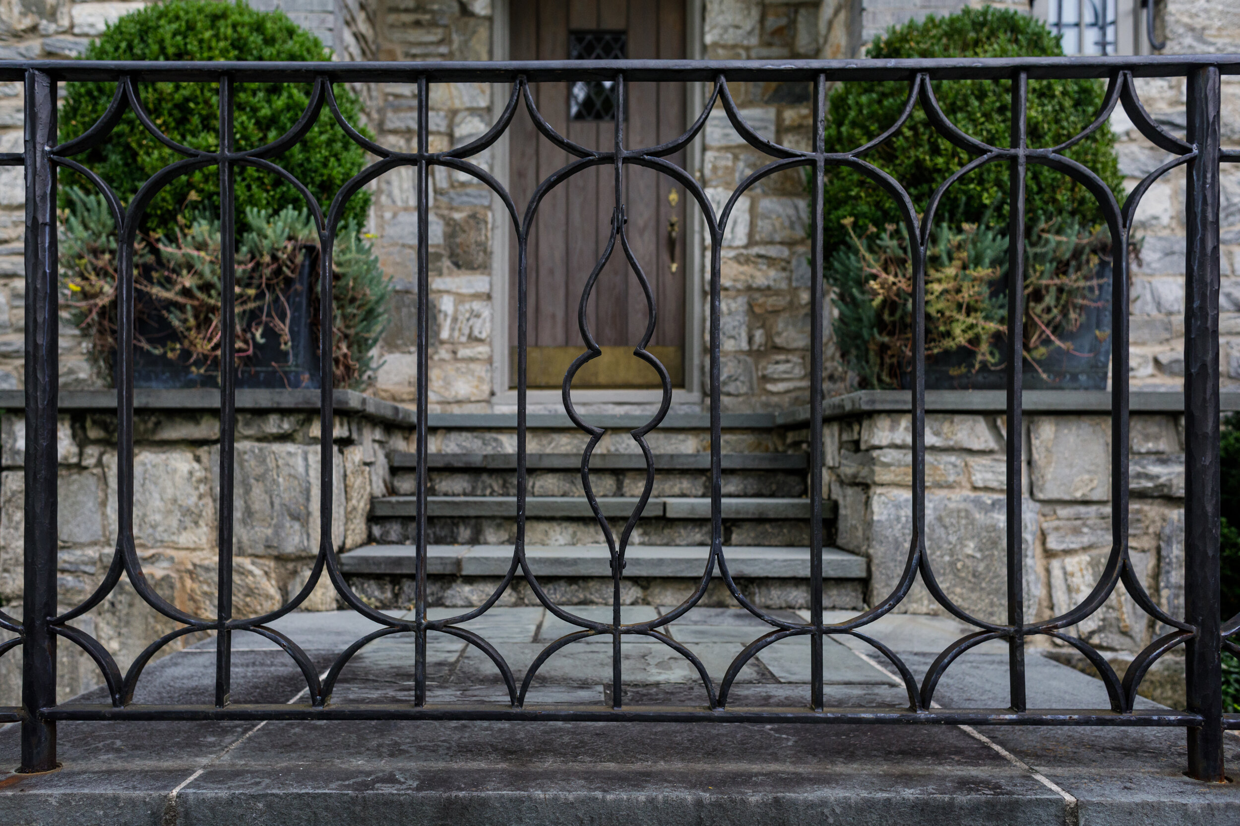 image of an exterior ornamental guardrail made by blacksmiths at smithworks iron and design