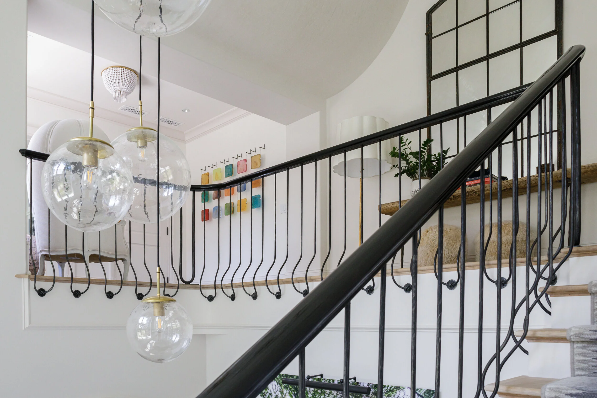 image of a stairwell in an interior space featuring custom ironwork by smithworks iron and design