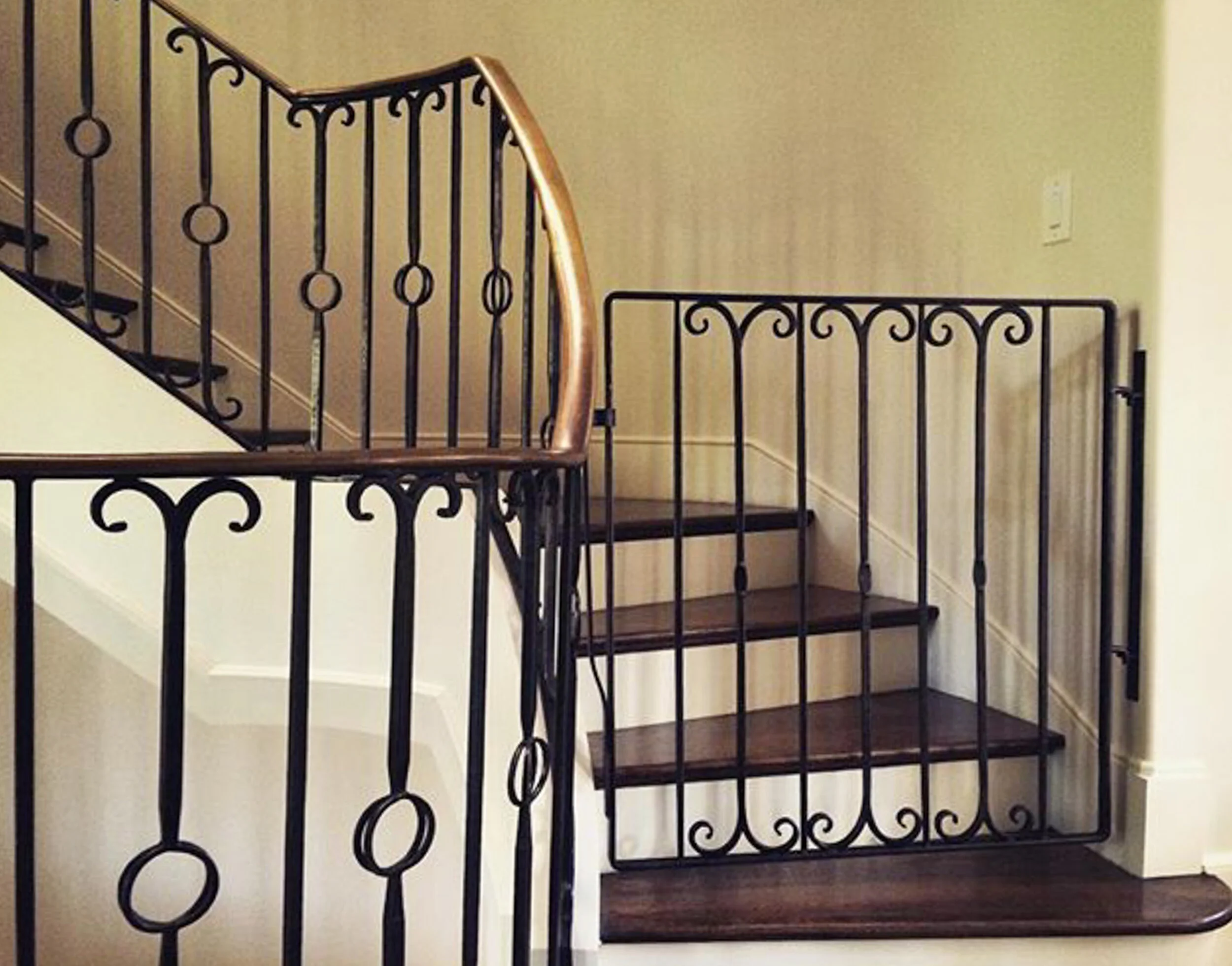 image of custom railing and stairway gate by smithworks iron and design