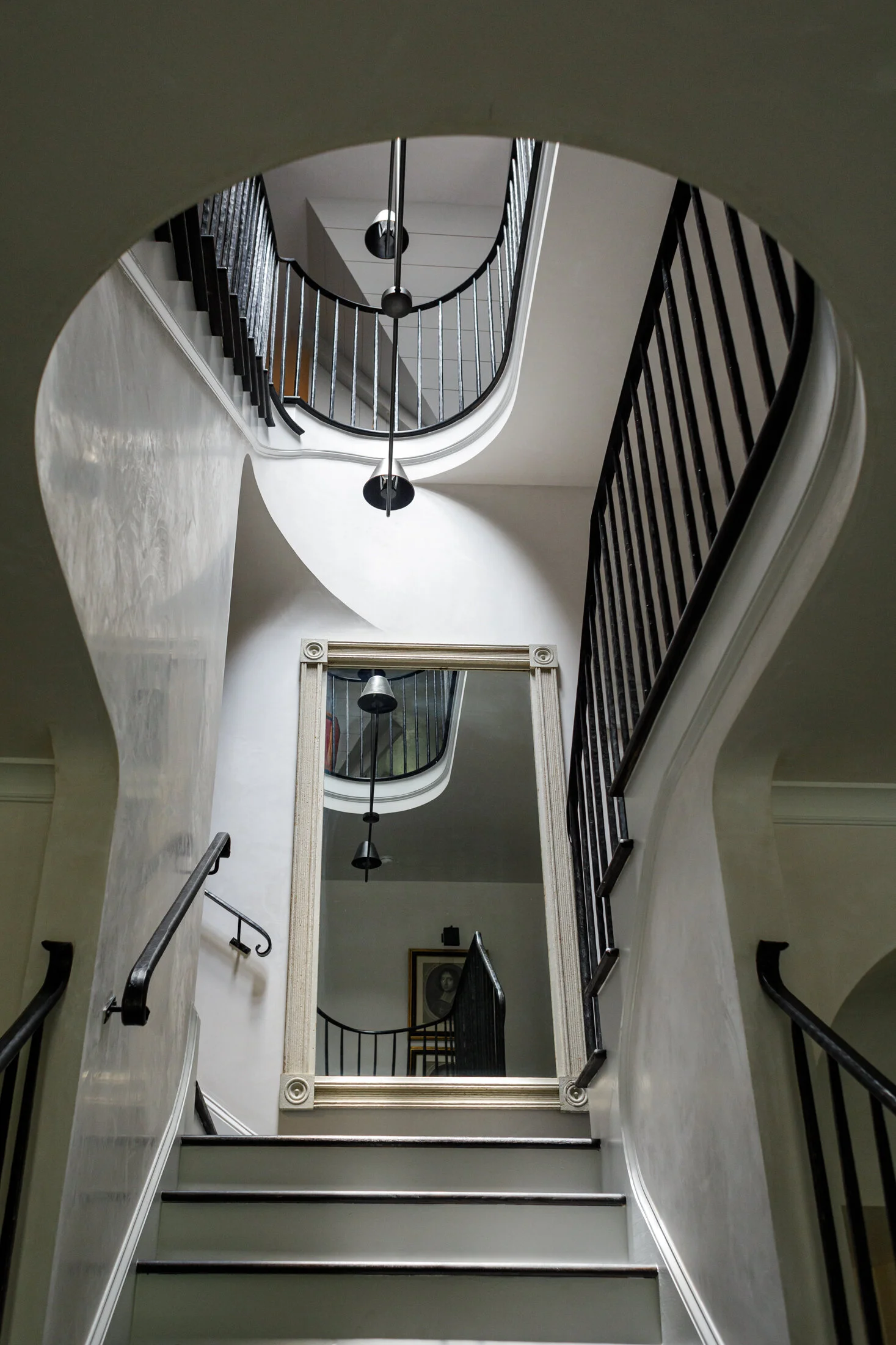 image looking into a stairwell with railings created by smithworks iron and design