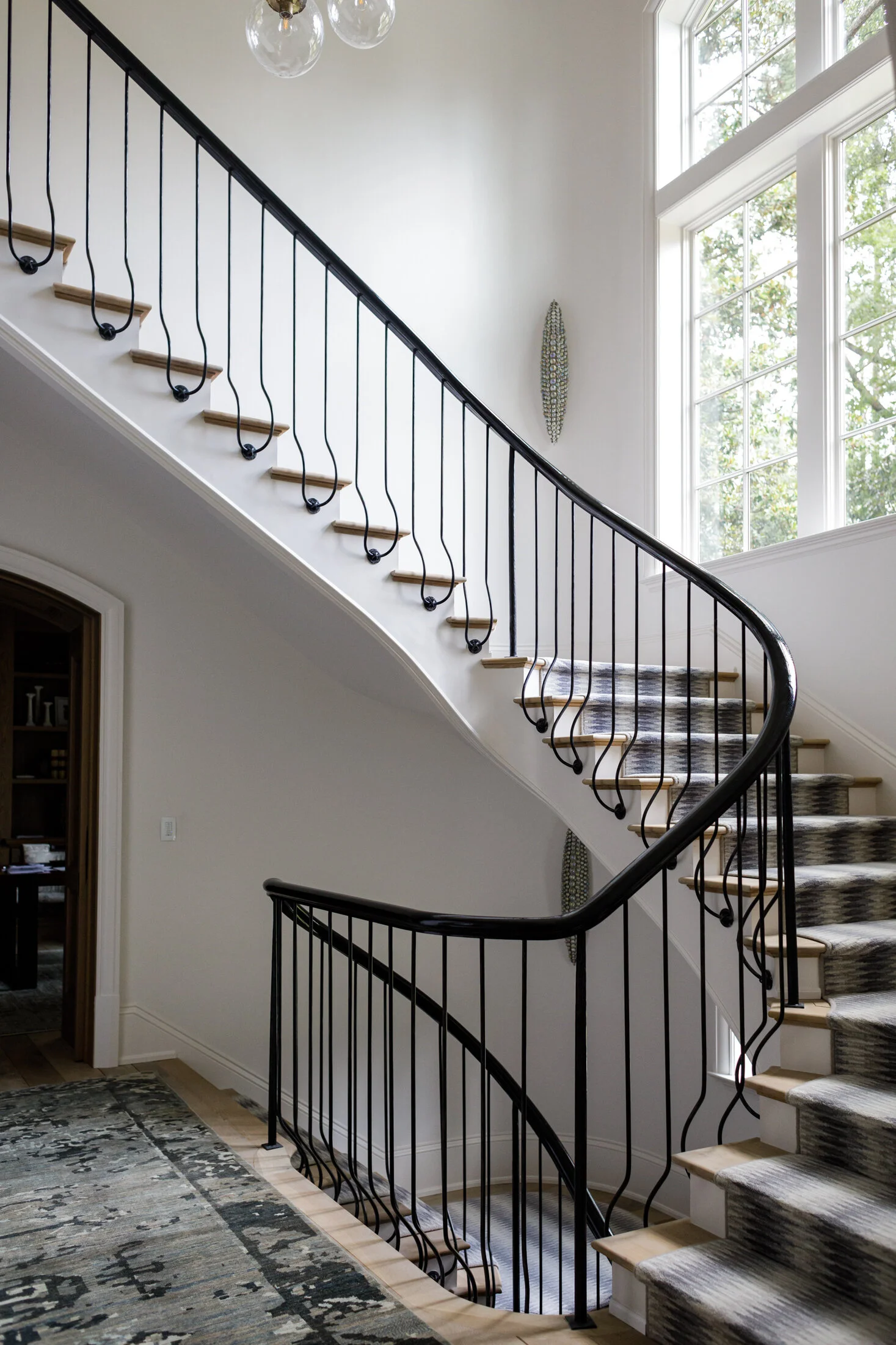 image of interior winding staircase with railing made by smithworks iron and design