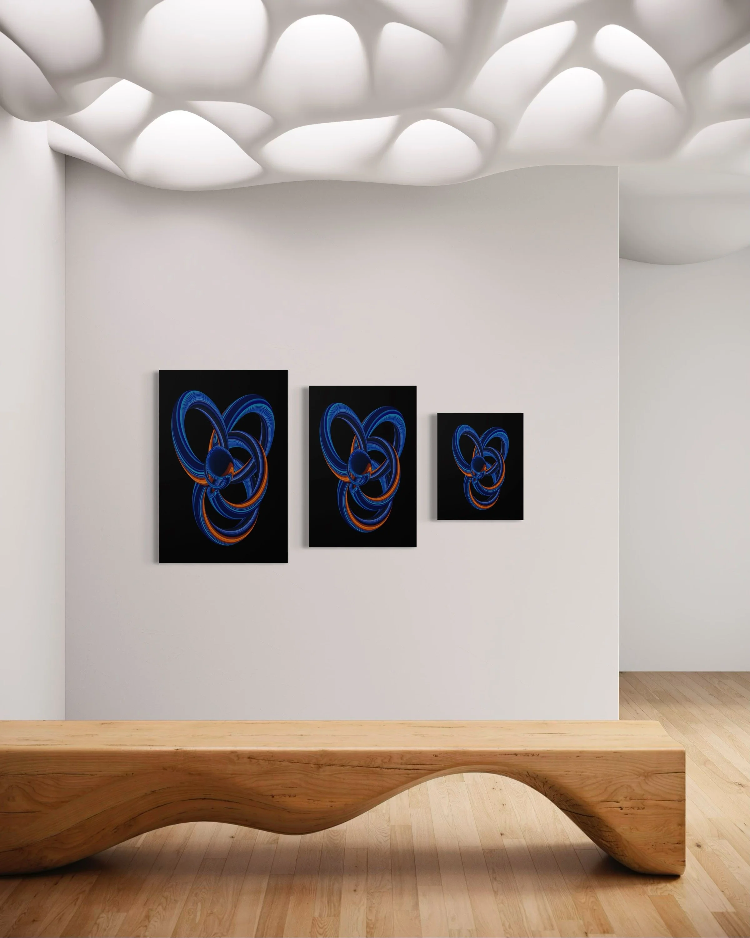 Three modern abstract paintings with blue and orange looping lines on black backgrounds hanging on a white gallery wall. A wooden bench with a curved design is positioned in front of the wall.