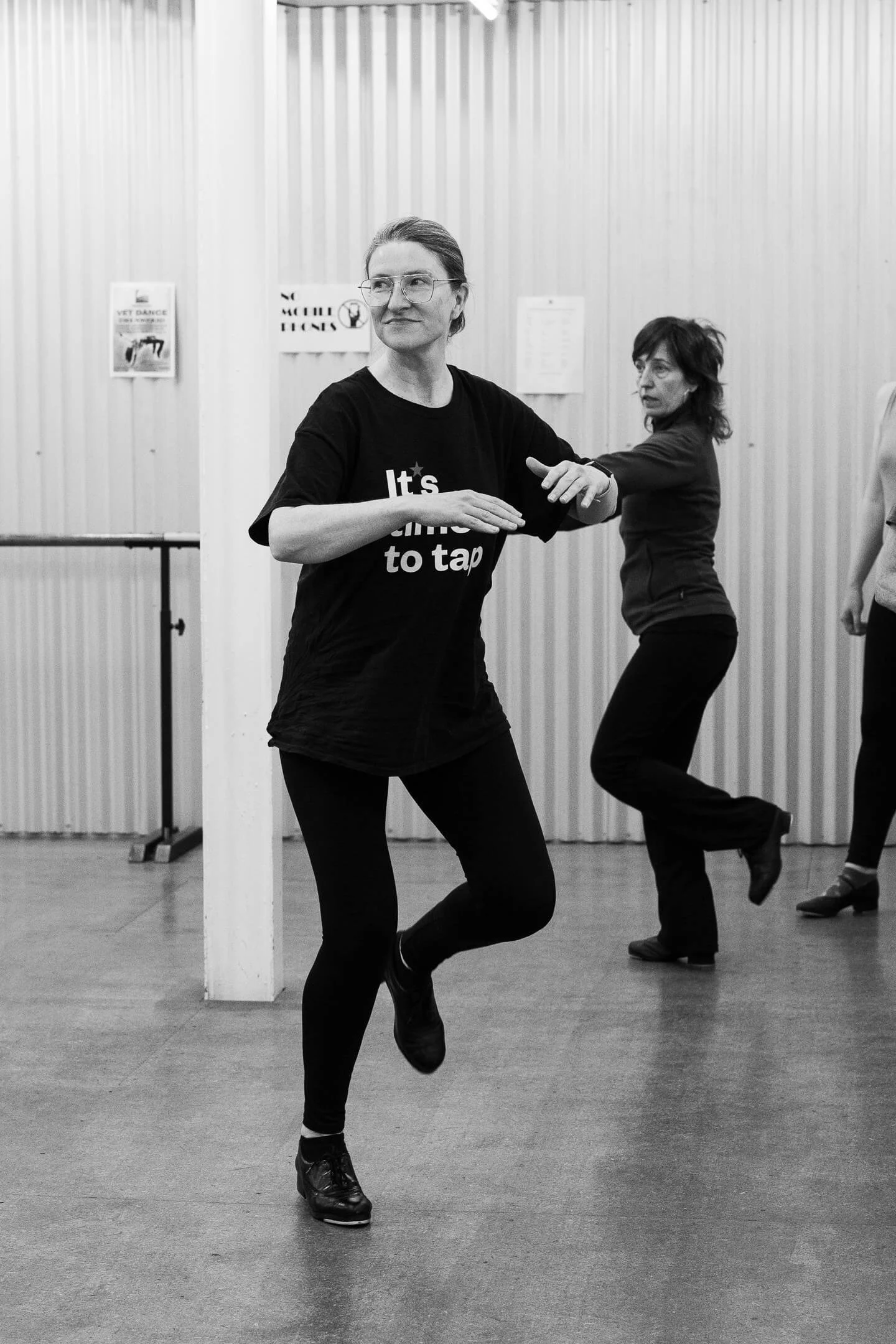B&W image of two female dancers learning tap dance at a Melbourne Dance class for adults 