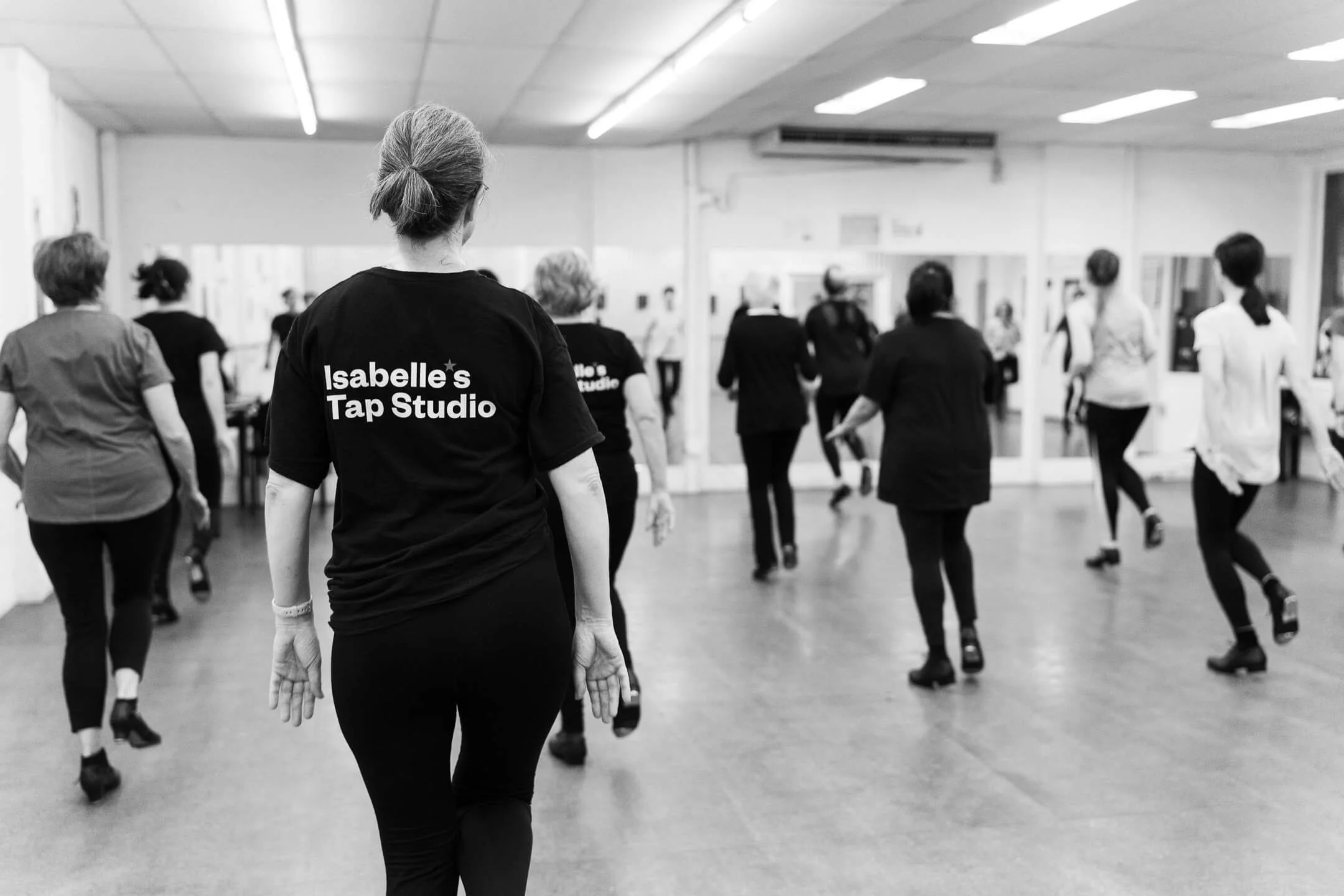 A group of women tap dancing at Isabelle's Tap Studio