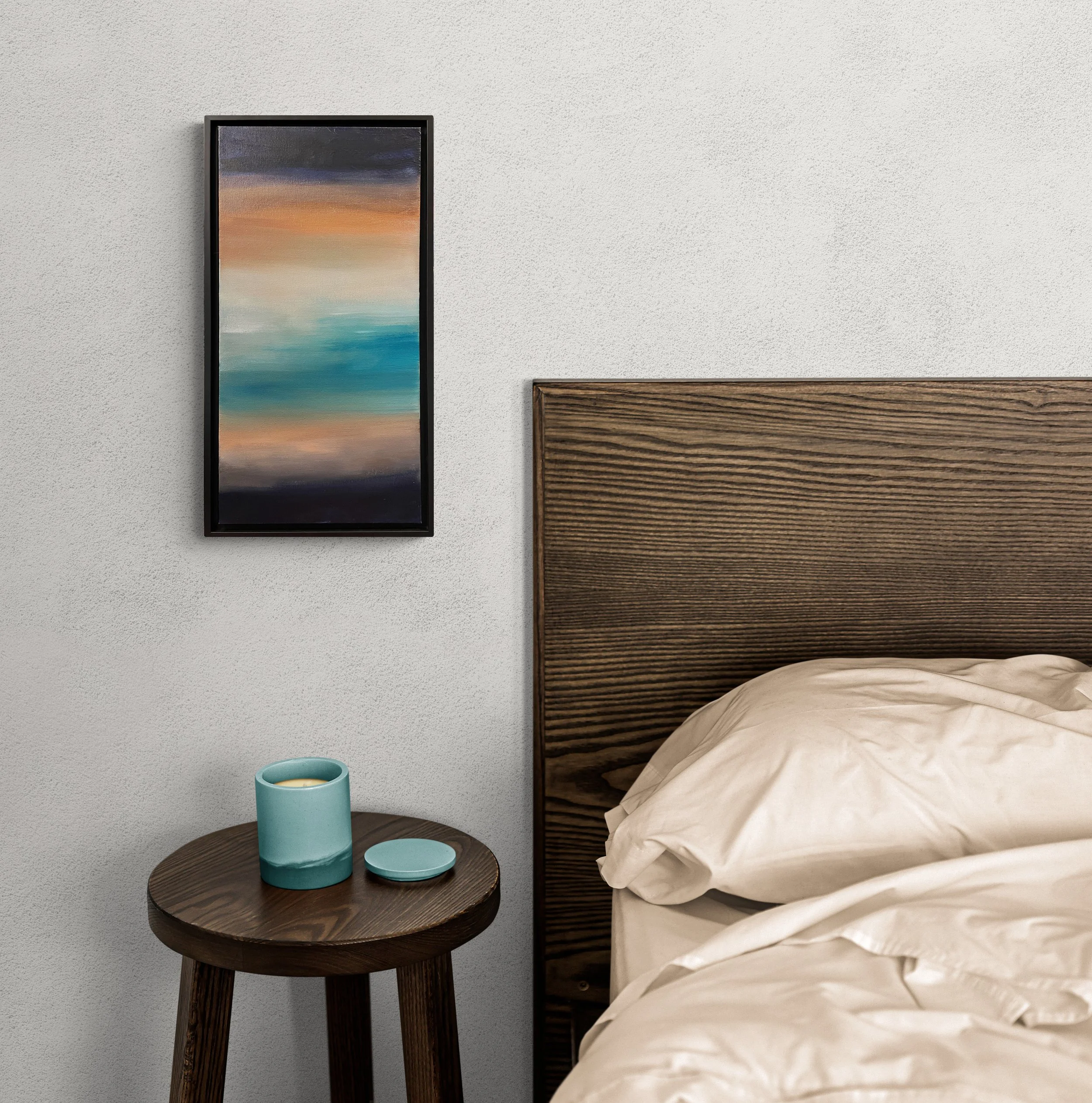 A bedroom with a wooden headboard, beige bedsheets, a bedside table with a turquoise candle, and an abstract painting on the wall.