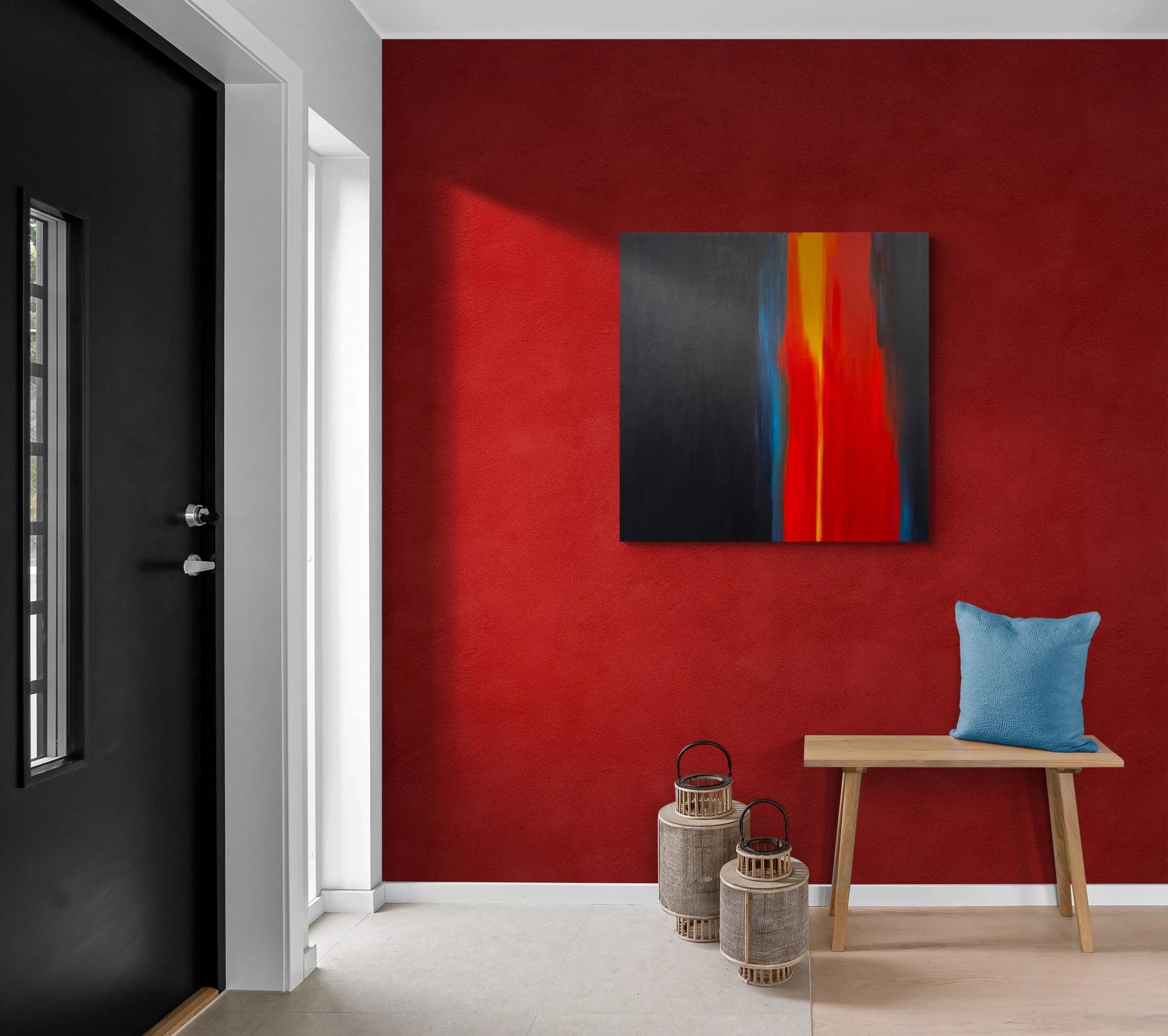 Interior view of a modern entryway with a black front door, white door frame, and a red accent wall with an abstract painting. There is a small wooden bench with a blue pillow, and two decorative lanterns on the floor.