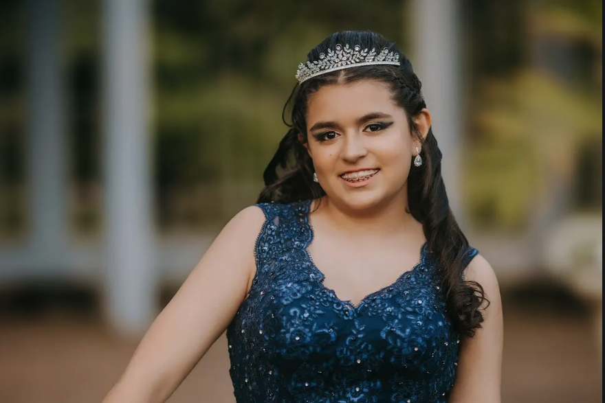 Teenage girl in a blue Quinceanera dress
