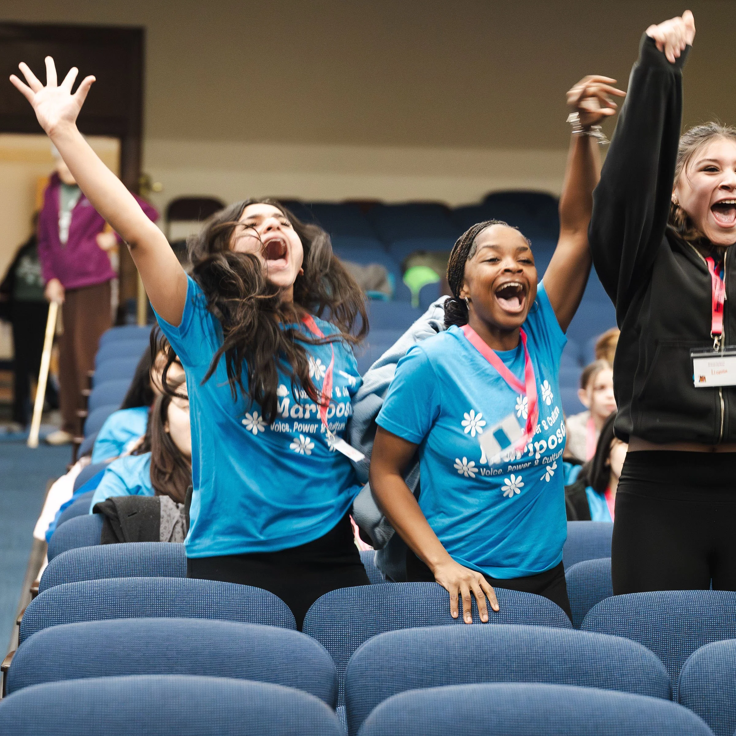 Group of three girls shouting with joy
