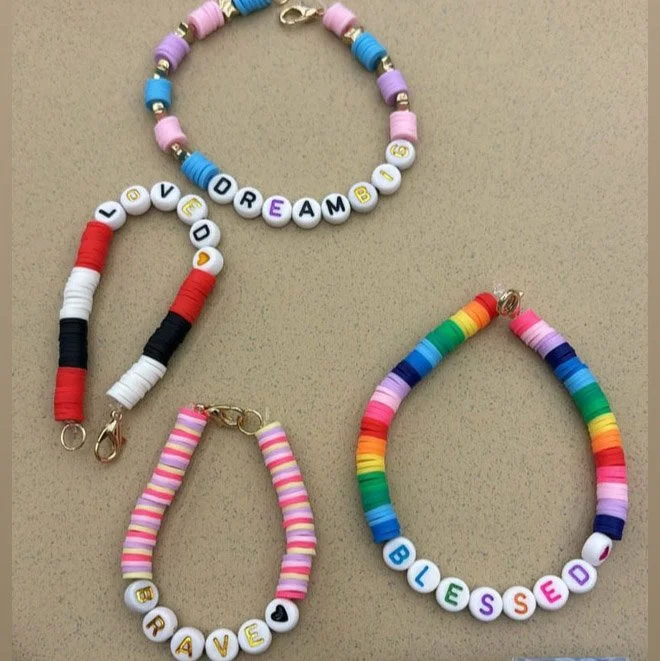 Image of four bracelets that say Dream, Loved, Brave, and Blessed