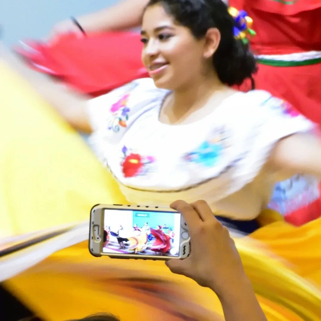 Girl in traditional dress during a Latin festival