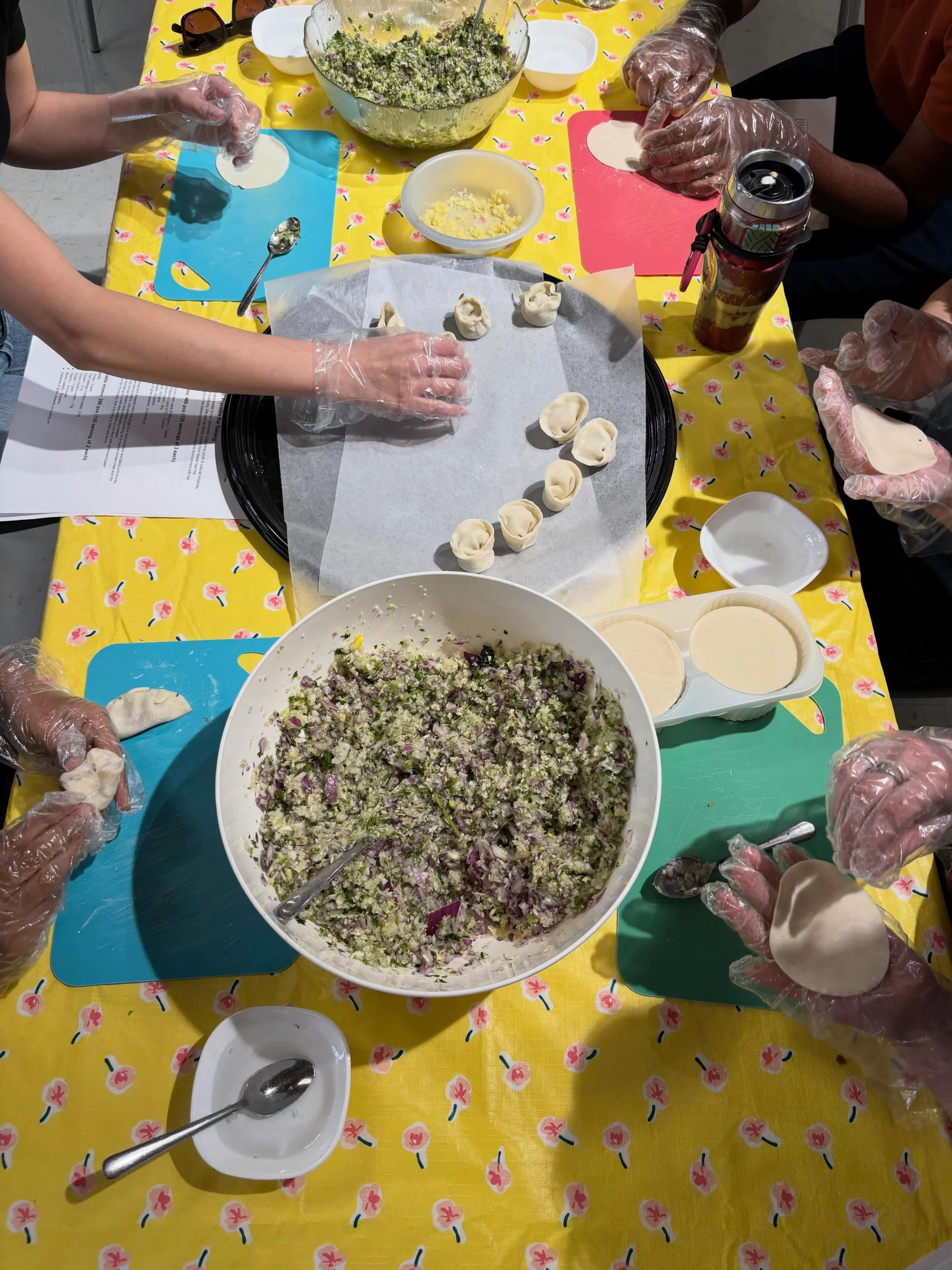 Moments from our last Community Cooks class, Mother&rsquo;s Day Momo!

We made over 500 momo, a specialty dish from Nepal, to share with community! Pravatika, our cooking lead, reminded us that momo are often made communally, with friends and family 