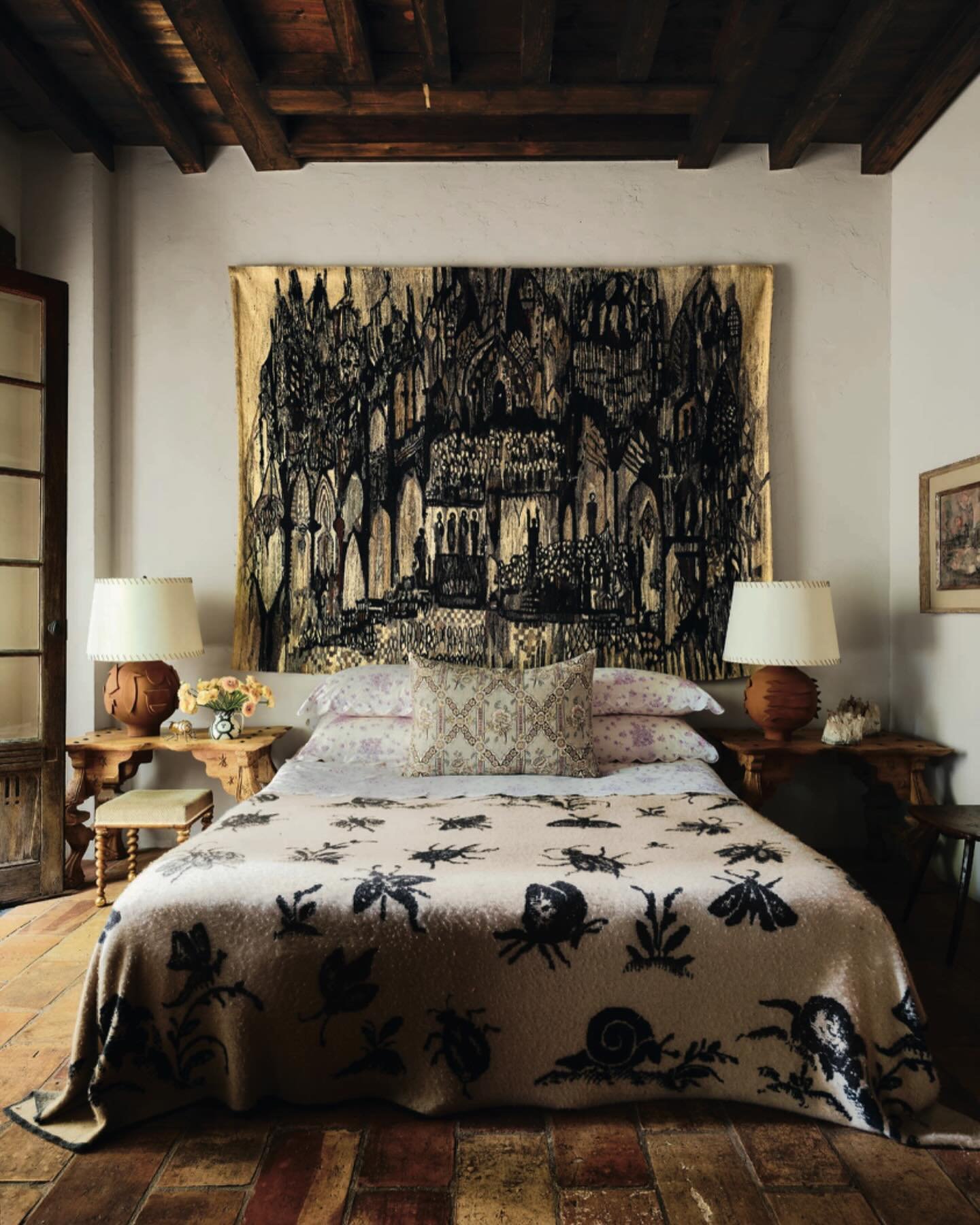 The bedroom at Horatio, which had a certain monastic comfort to it even before I hung a gothic midcentury tapestry that belonged to my parents above the bed, forgoing a headboard. The pairing of this tapestry and the lilac @dporthaultparis linens was