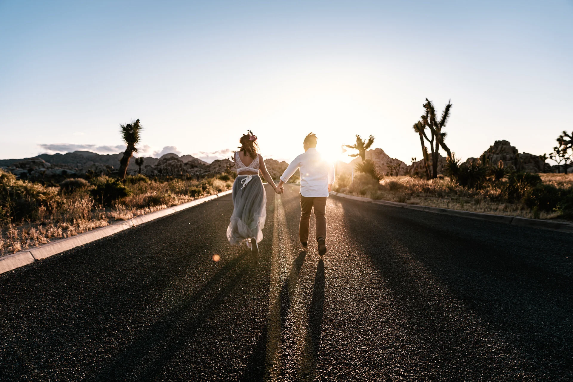 couple runs off into sunset after ceremony