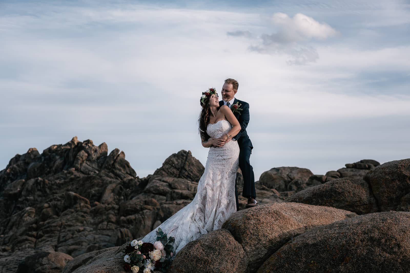 eloping couple gets close on the rocks of alabama hills