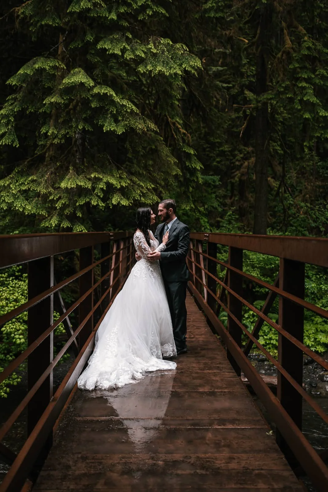 rainy bridge makes perfect setting for romantic wedding photos marymere falls