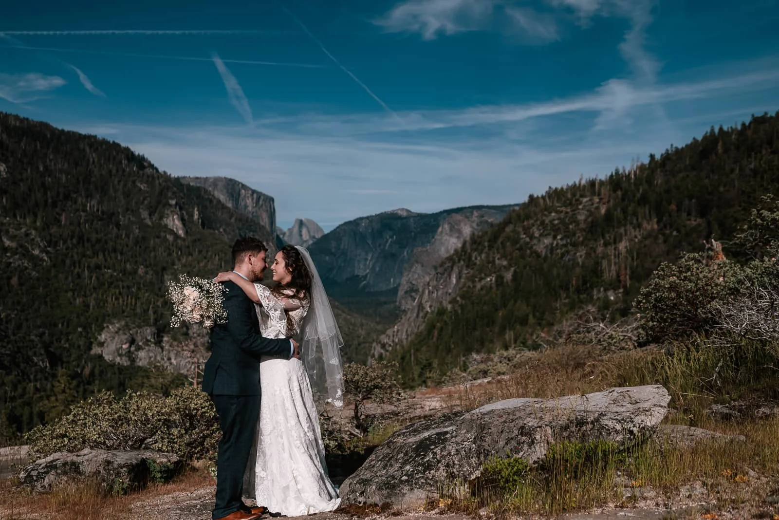 english bride kisses her new husband on a sunny day on turtle dome