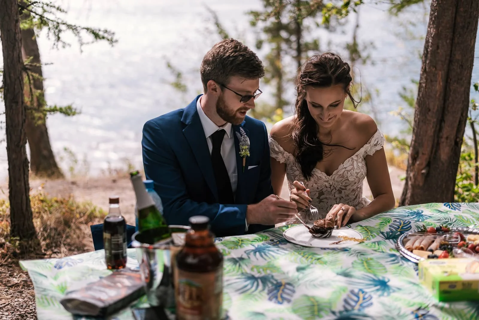 Bride and Groom enjoy a picnic after their wedding ceremony.