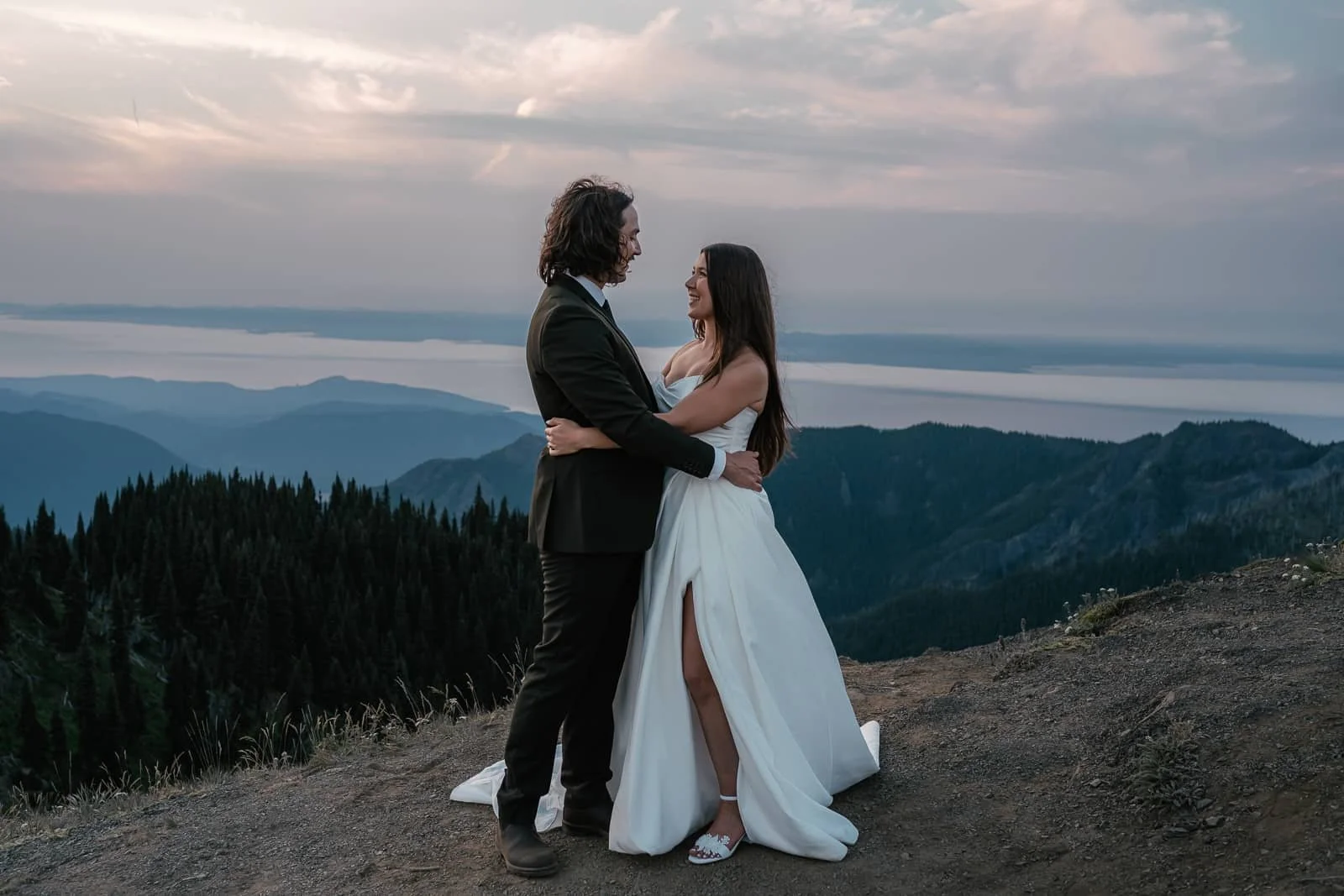 bride and groom stare into each others eyes atop hurricane ridge