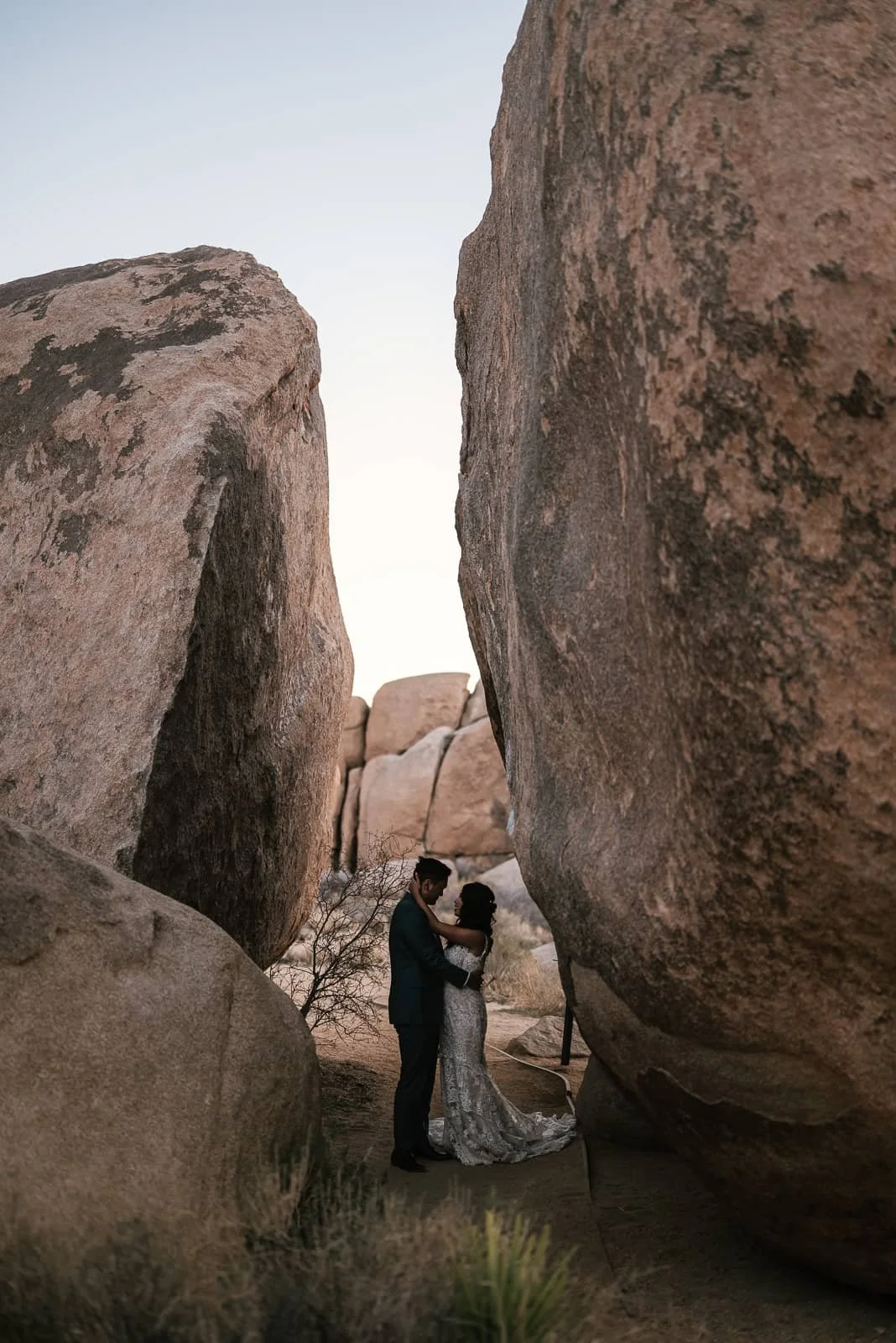 elopement couple poses for their photographer in Cap  Rock