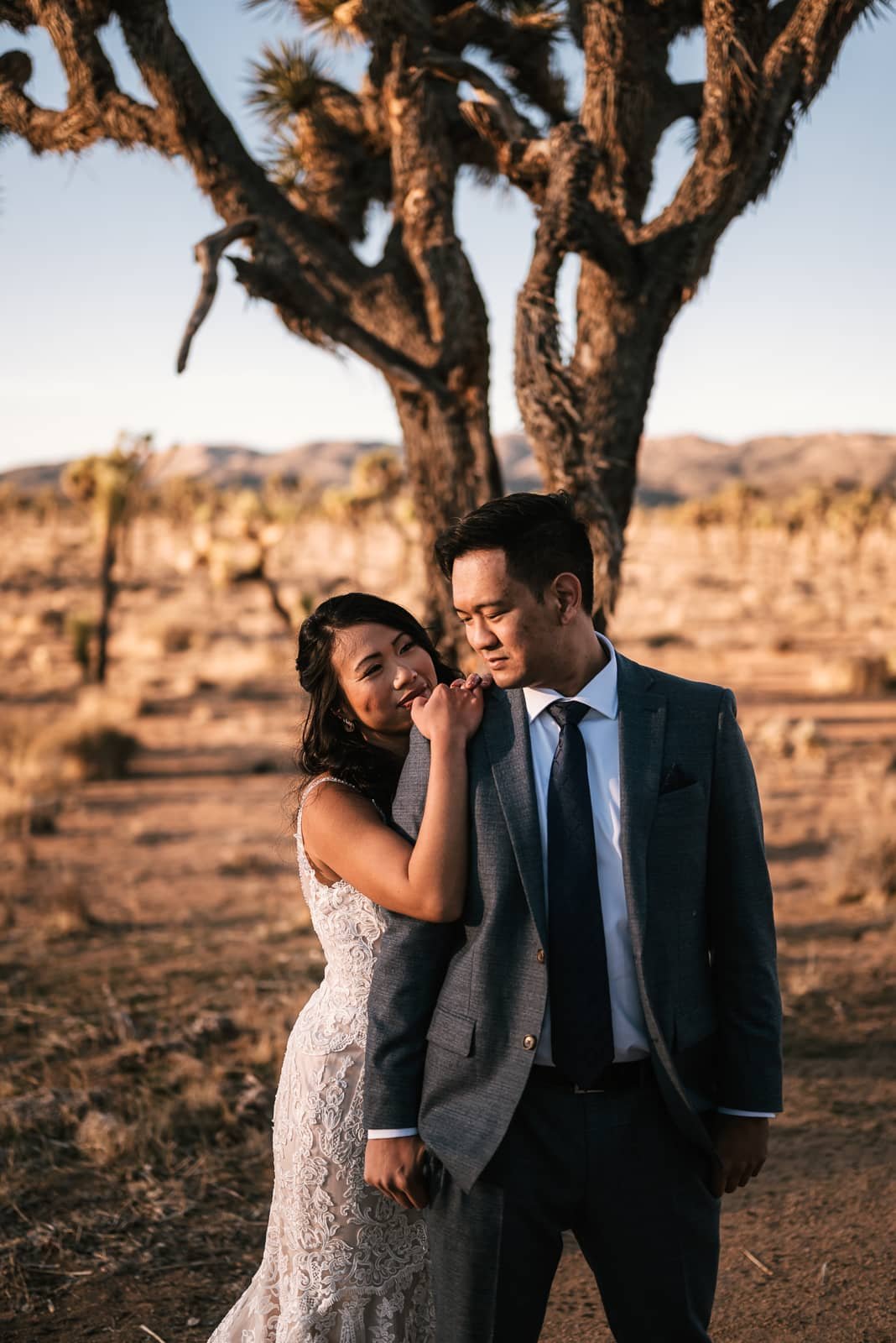 couple poses for their joshua tree elopement photographer