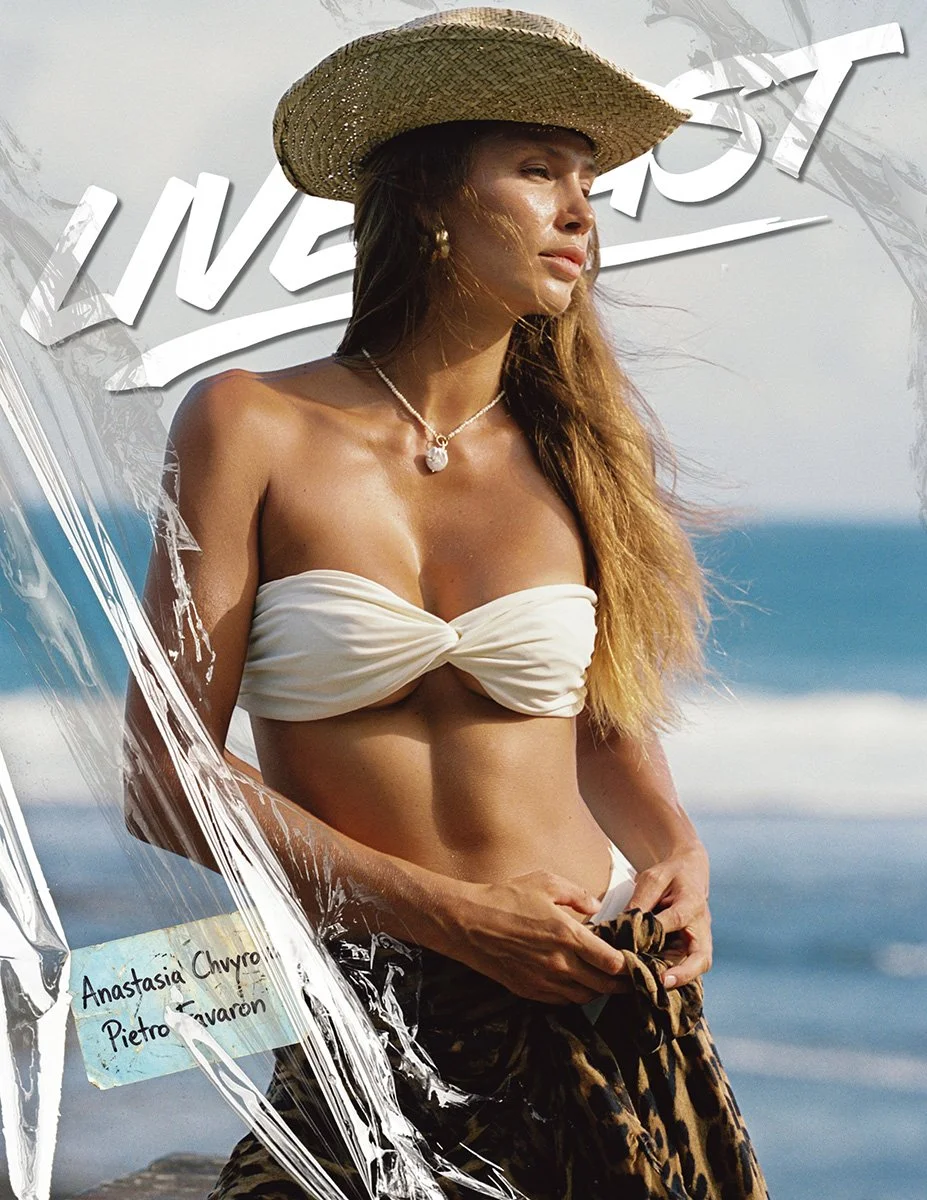 Anastasia Chvyrova photographed by Pietro Favaron on a Bali beach. Natural light. Ocean backdrop. Calm, sun-washed editorial portrait.