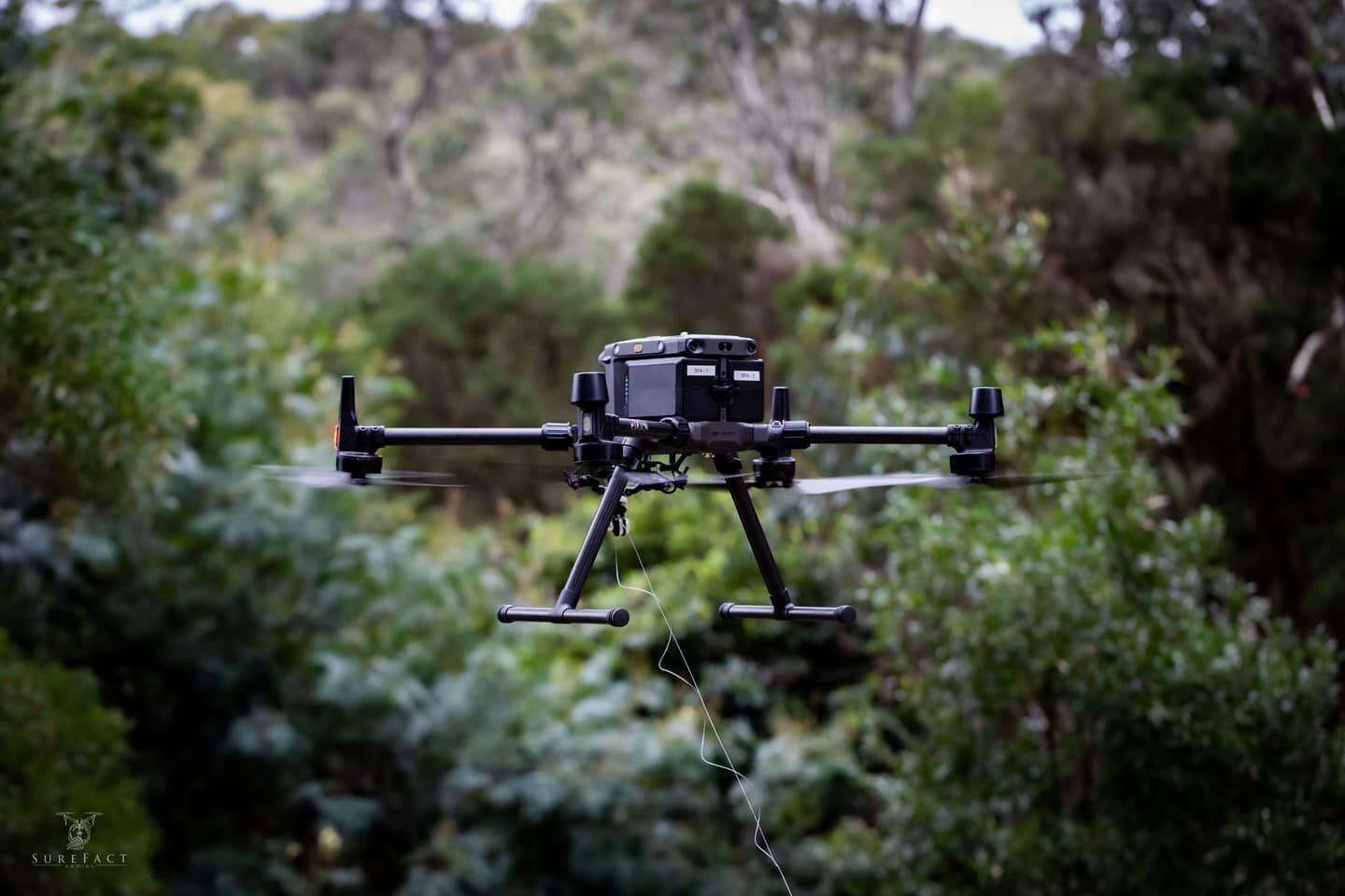 Another amazing job by the SureFact Aerial Team today. 

The bad weather in Melbourne didn't stop our M300 from carrying a guide wire above dense and difficult terrain to assist our client with stringing a new conductor. 

#Drone #Drones #Matrice300 