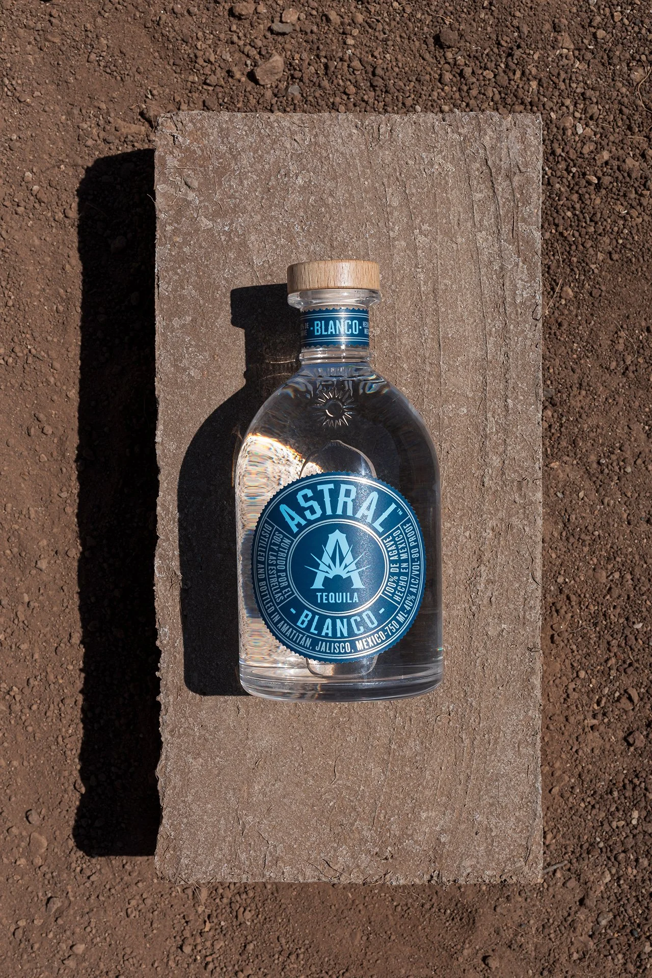 A refined product image by Shava Cueva, Melbourne based photographer specialising in spirits and premium beverages. The bottle sits on stone, highlighting craft and clarity.