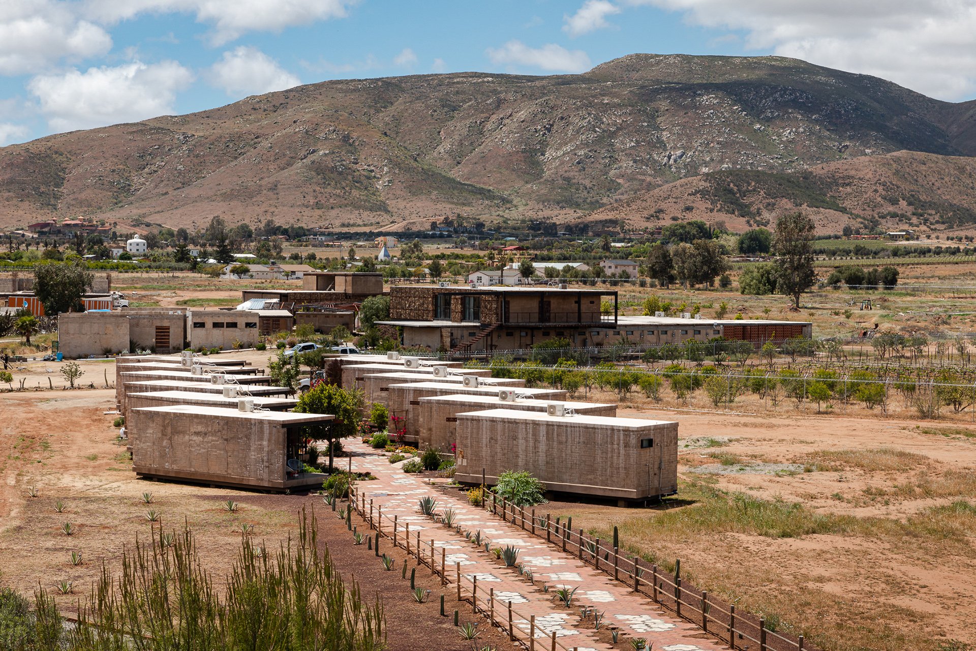 Panoramic views of boutique eco-cabins surrounded by vineyards and mountains, offering a tranquil retreat for luxury travelers. Specializing in sustainable spaces, my photography brings out the natural beauty and unique architectural features of dest