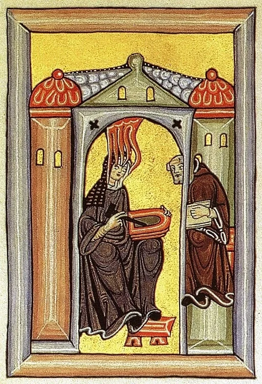 Ein Relief von Hildegard von Bingen in einem Gespräch mit einem Mönch ist hier zu sehen