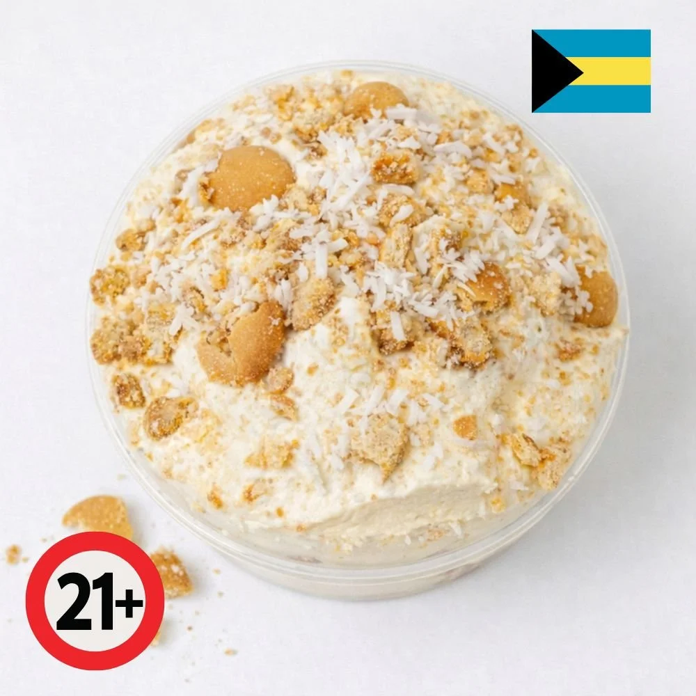 Sky Juice spiked coconut pudding topped with coconut flakes and vanilla wafers