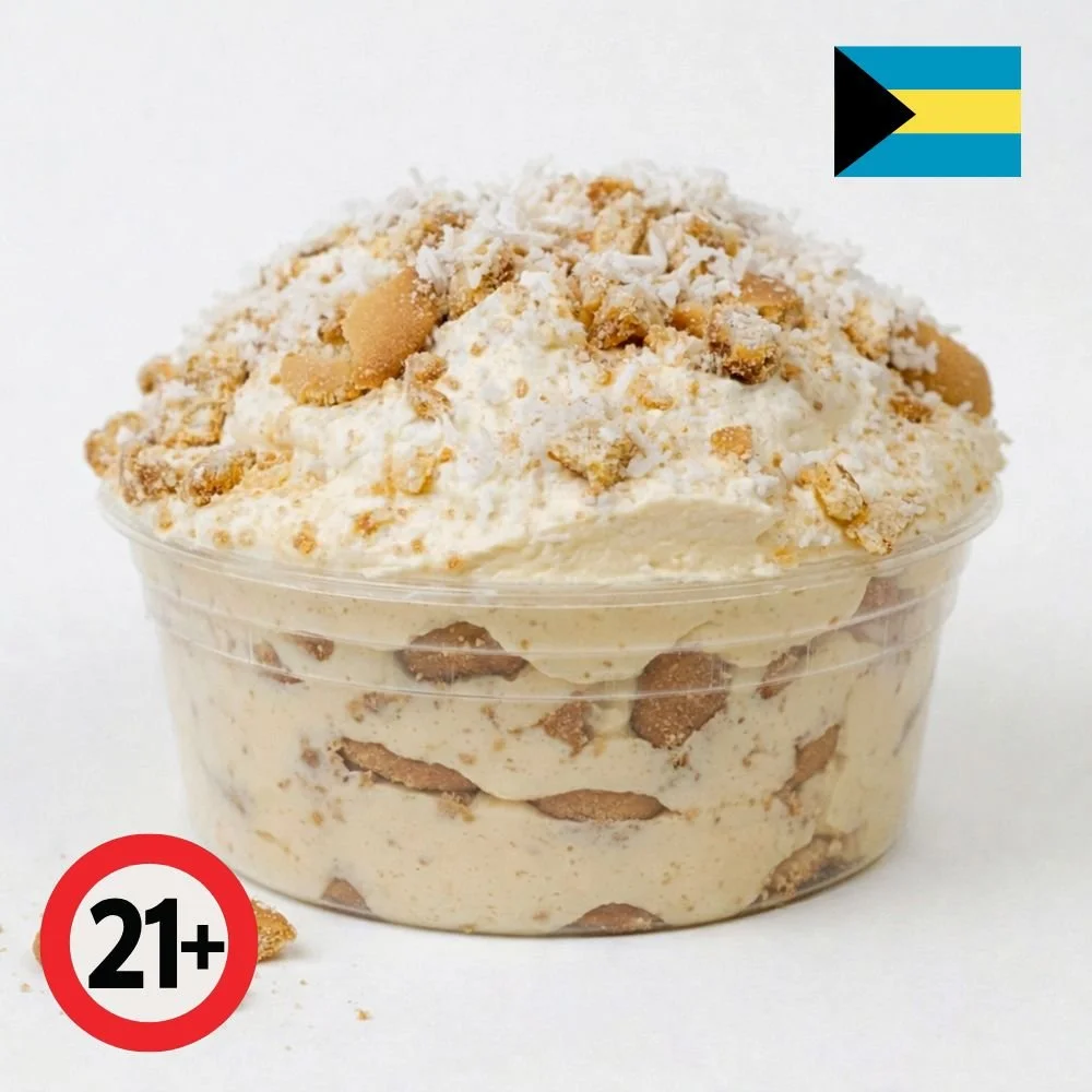 Sky Juice spiked coconut pudding topped with coconut flakes and vanilla wafers