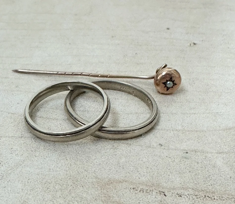 together with the stick pin